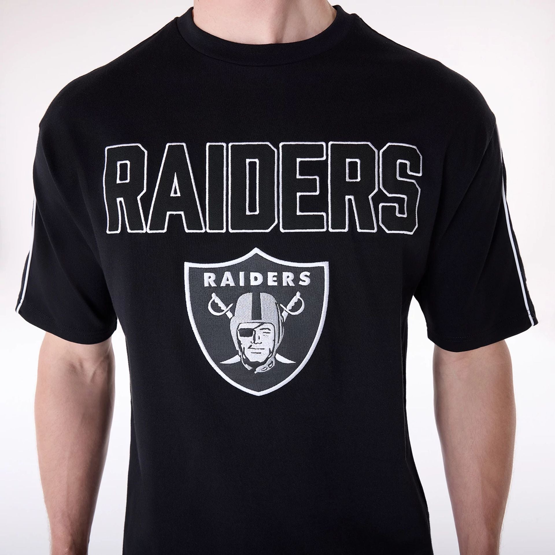 The Male model is wearing Las Vegas Raiders NFL Heritage Black Oversized T-Shirt 7