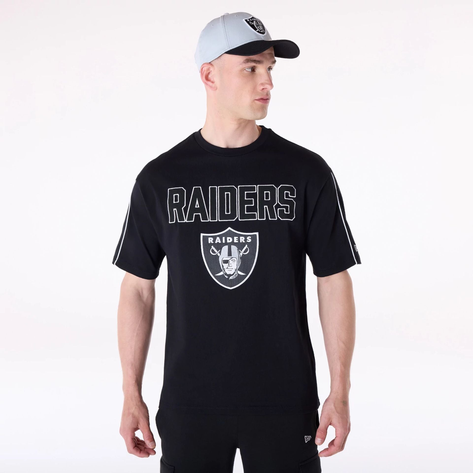 The Male model is wearing Las Vegas Raiders NFL Heritage Black Oversized T-Shirt 1