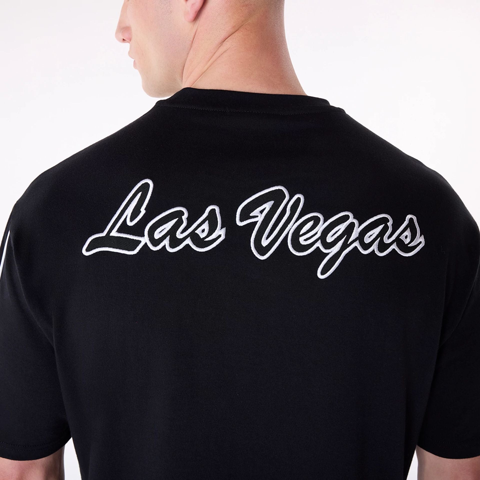 The Male model is wearing Las Vegas Raiders NFL Heritage Black Oversized T-Shirt 4