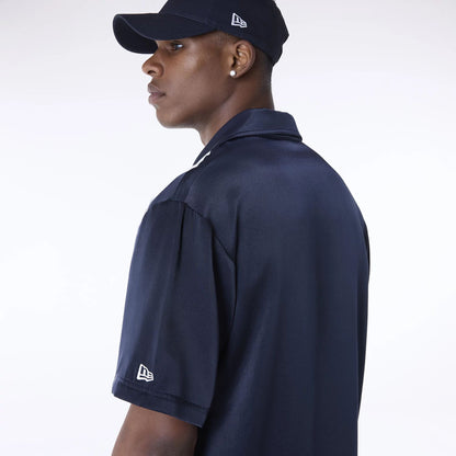 The Male model is wearing New Era Stripe Revere Navy Short Sleeve Shirt 6