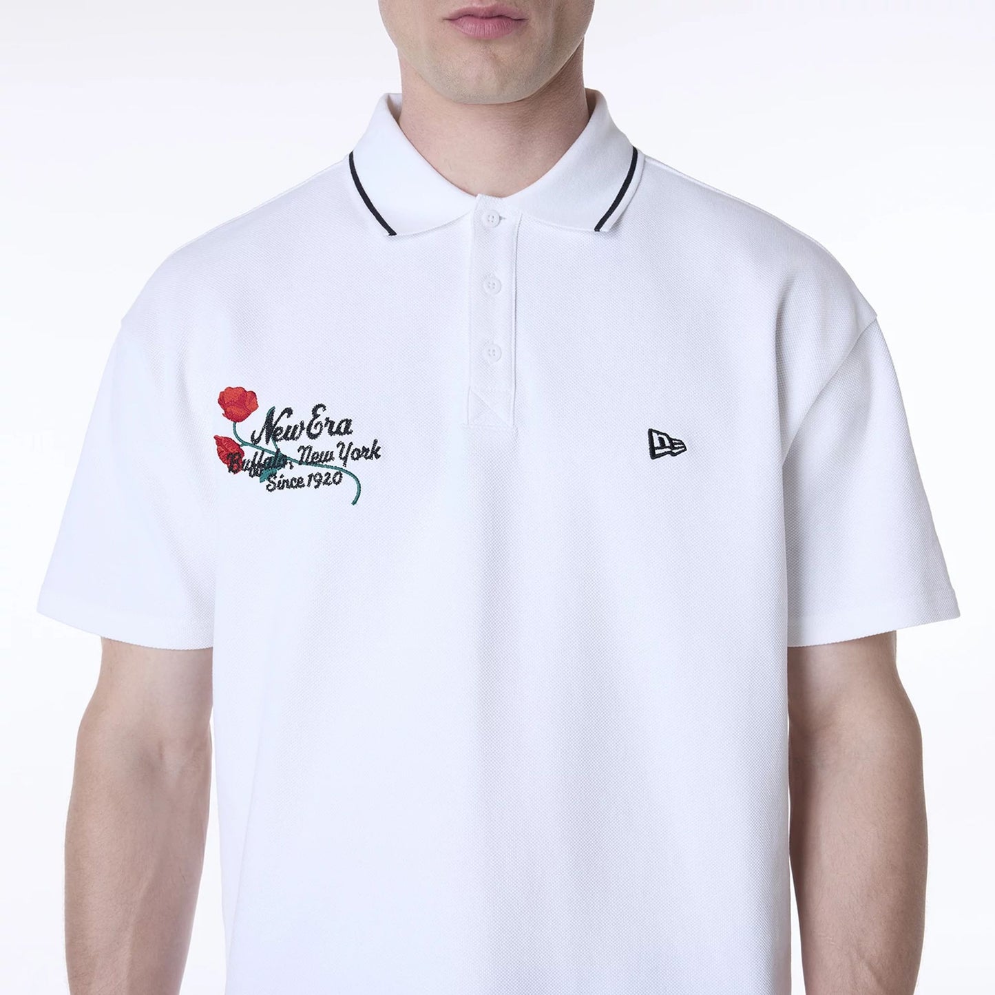 The Male model is wearing New Era Floral Polo White T-Shirt 7