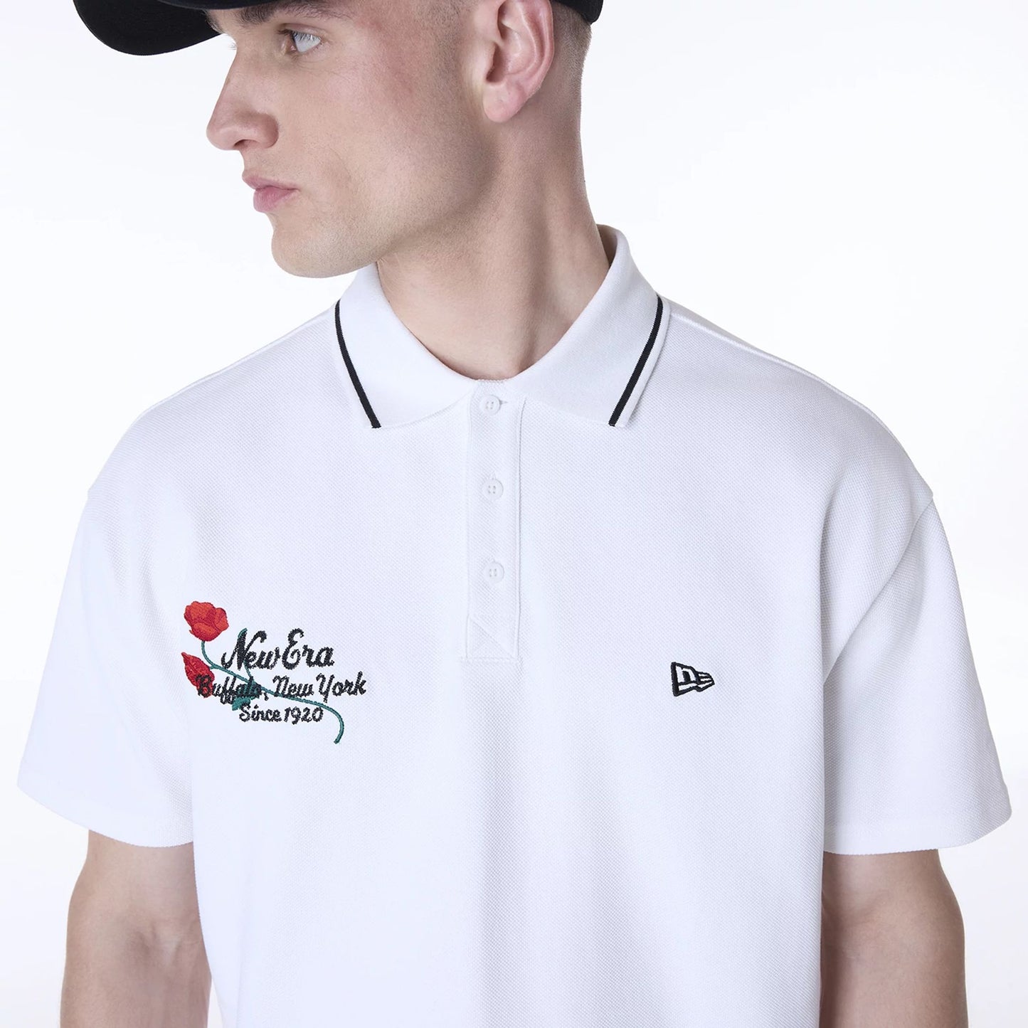 The Male model is wearing New Era Floral Polo White T-Shirt 6