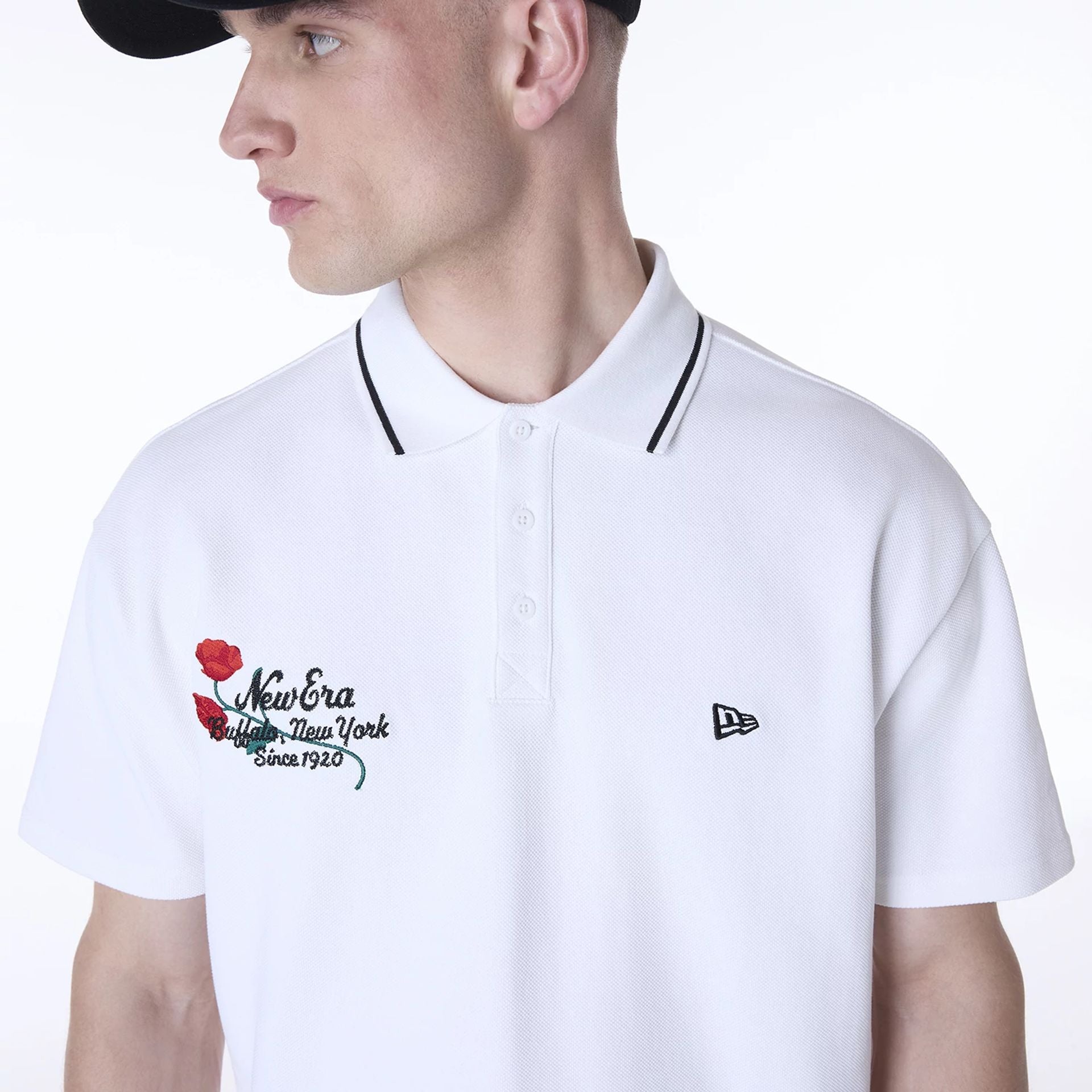 The Male model is wearing New Era Floral Polo White T-Shirt 6