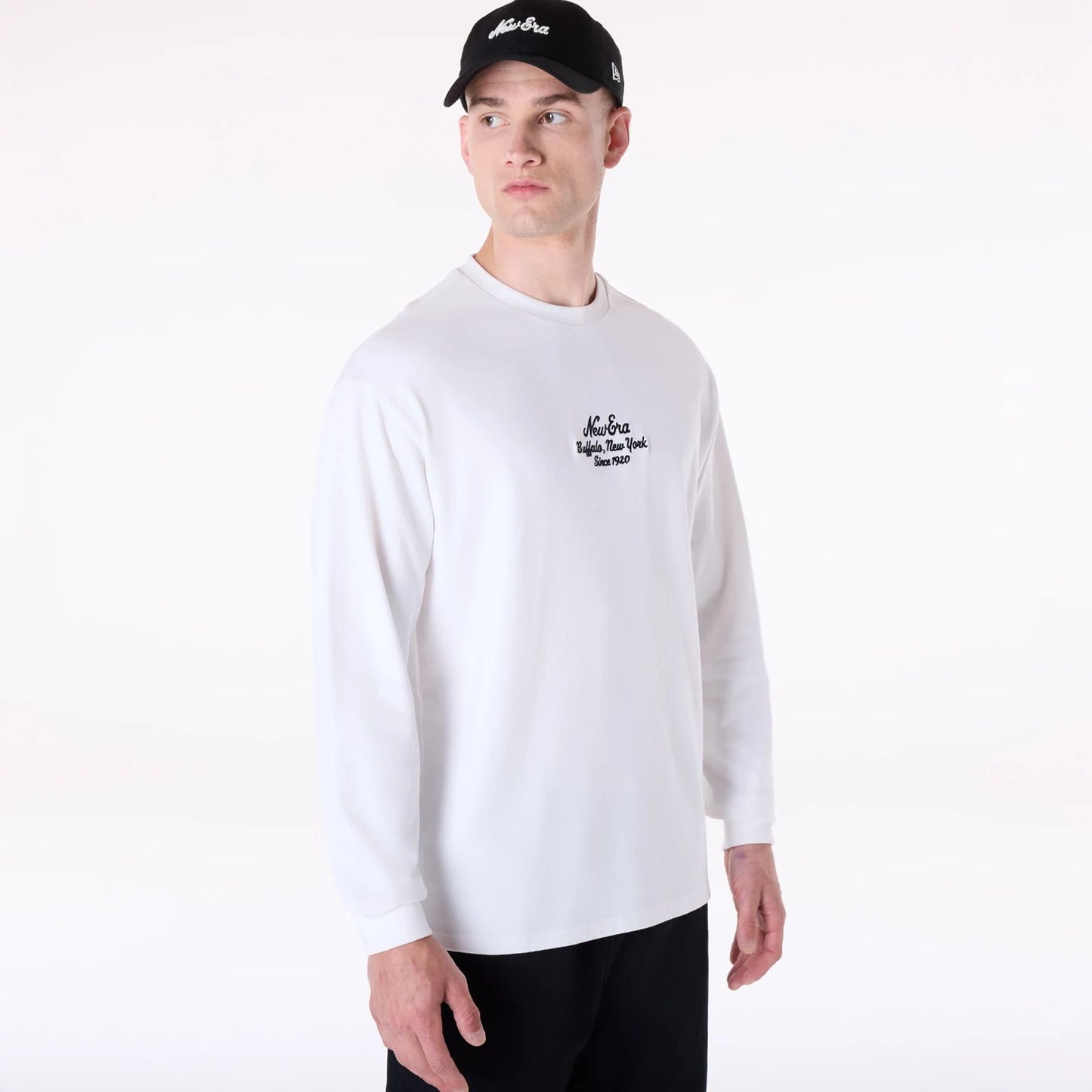 The Male model is wearing New Era Graphic White Long Sleeve T-Shirt 4