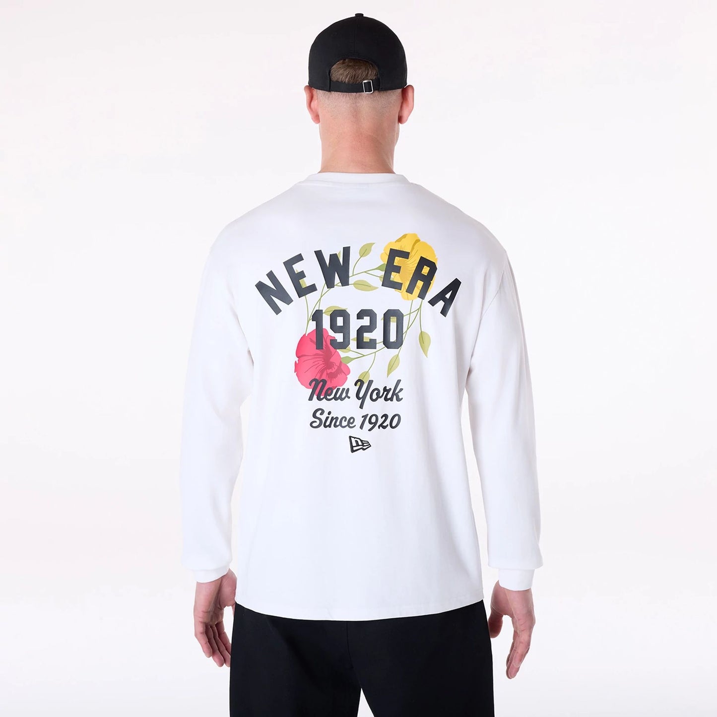 The Male model is wearing New Era Graphic White Long Sleeve T-Shirt 2