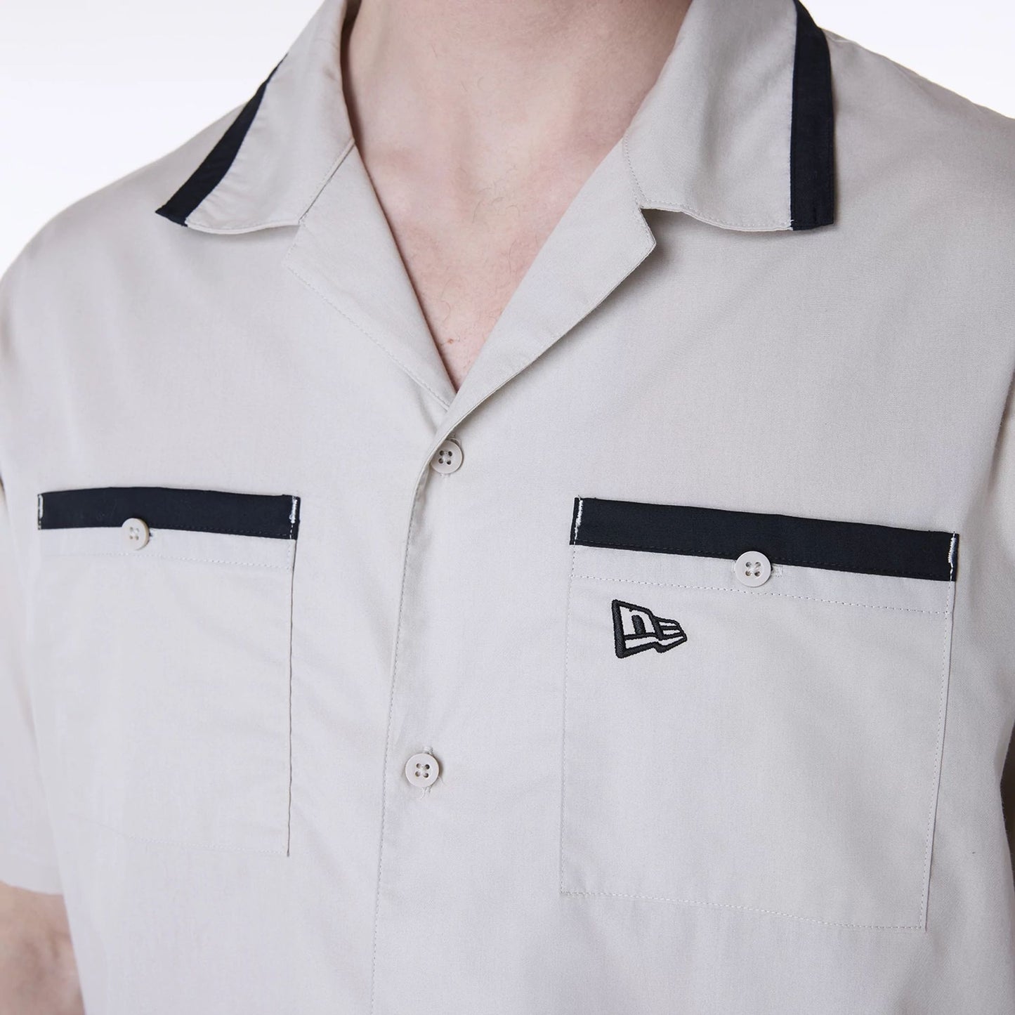 The Male model is wearing New Era Revere Cream Short Sleeve Shirt 6