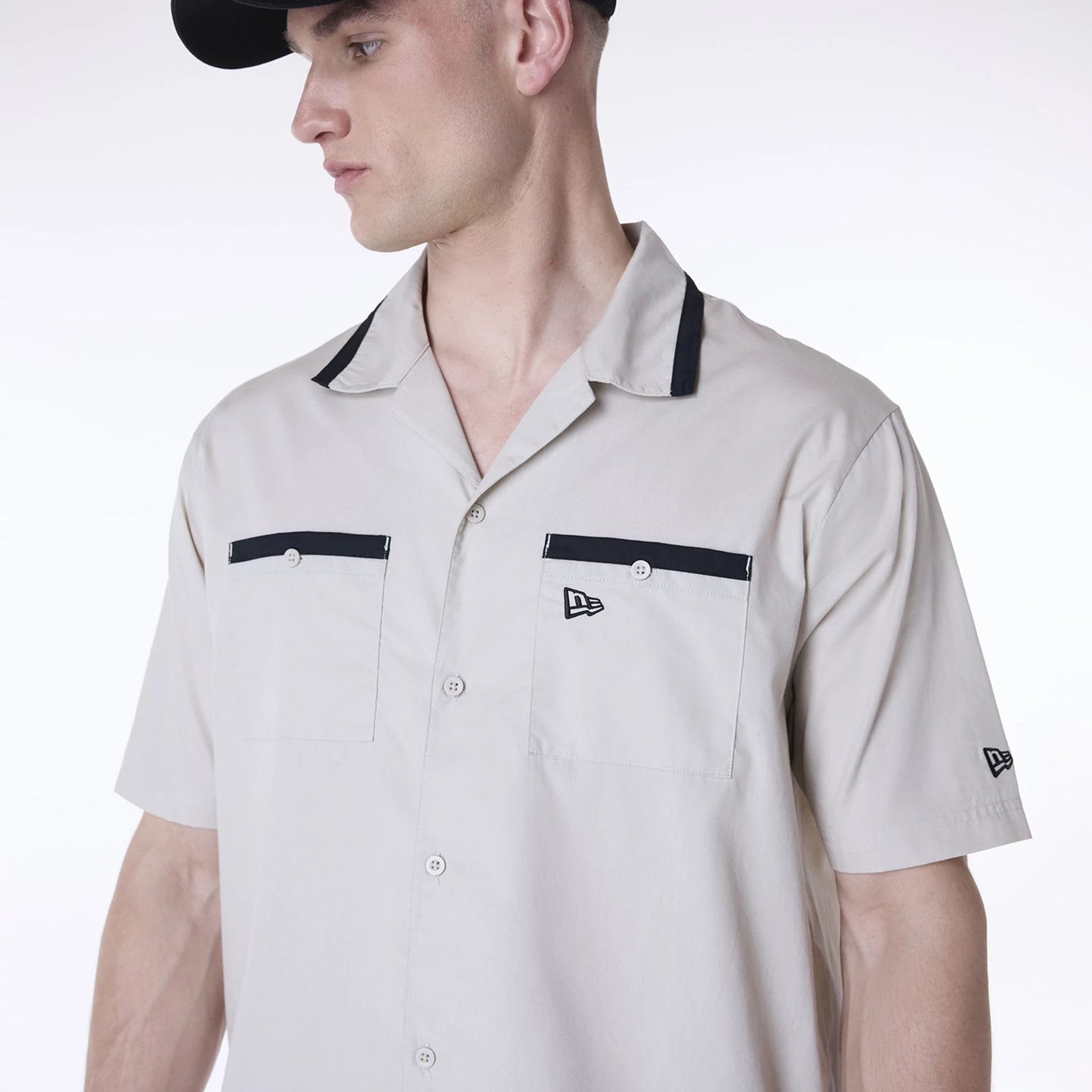 The Male model is wearing New Era Revere Cream Short Sleeve Shirt 3