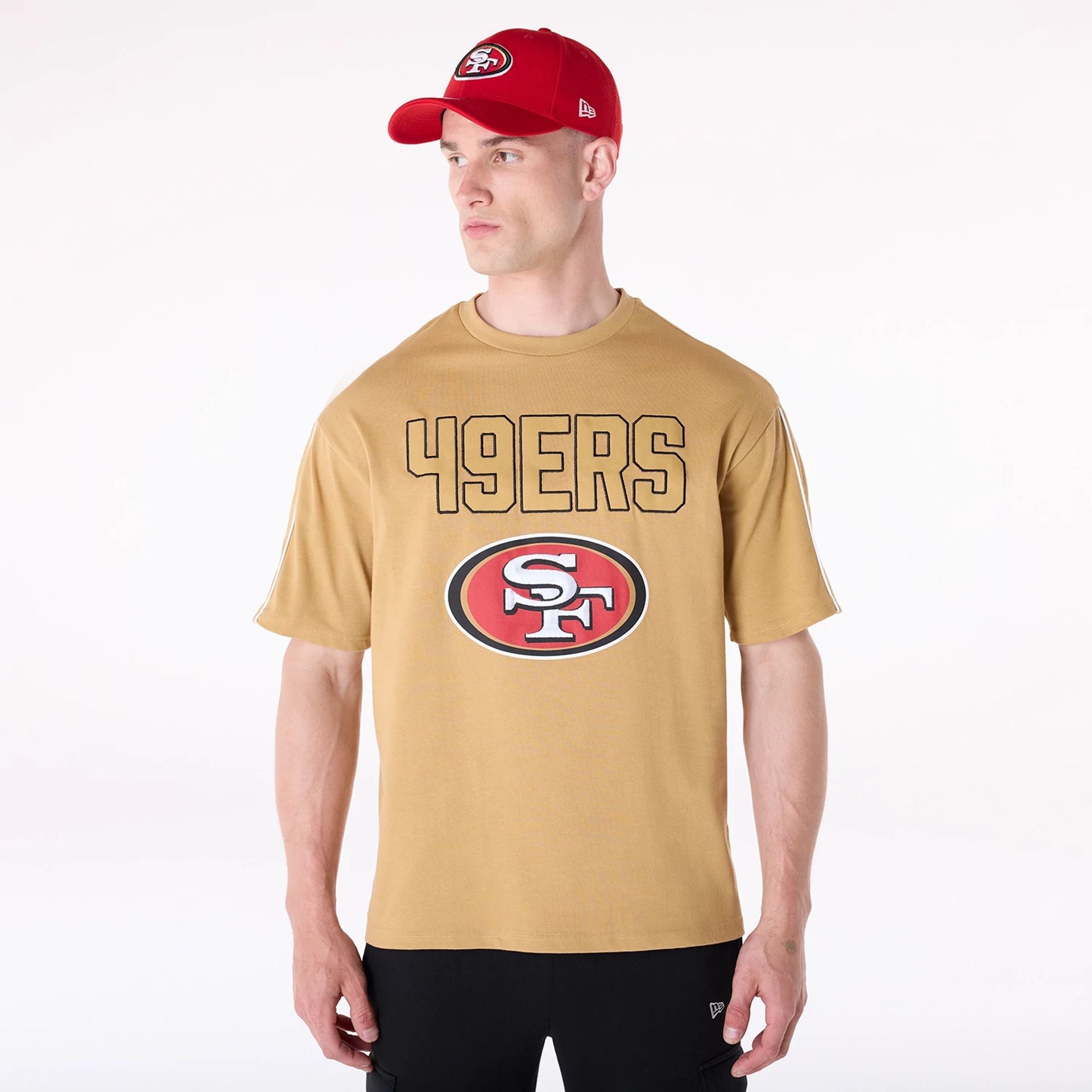 The Male model is wearing San Francisco 49Ers NFL Heritage Beige Oversized T-Shirt 1