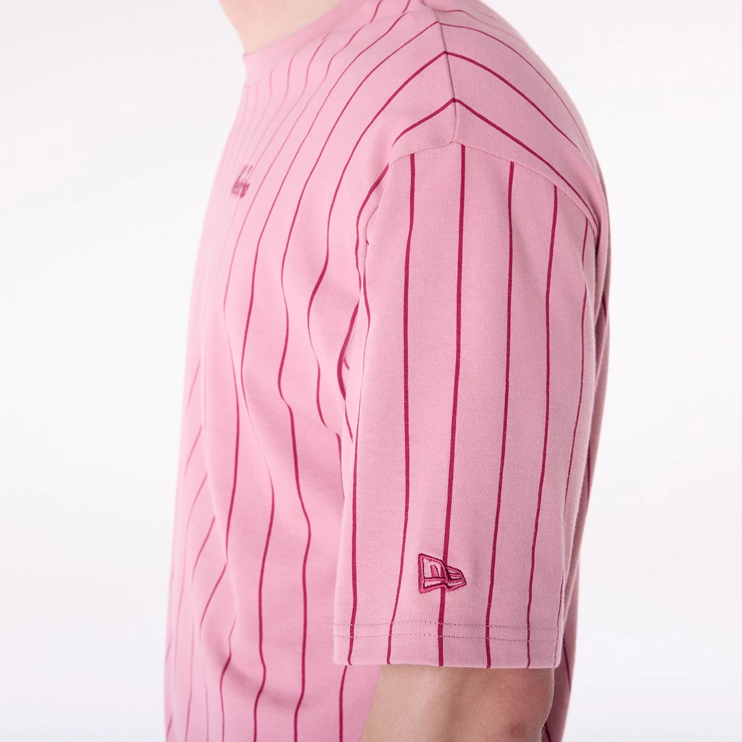 The Male model is wearing New Era Pinstripe Dark Pink Oversized T-Shirt 4