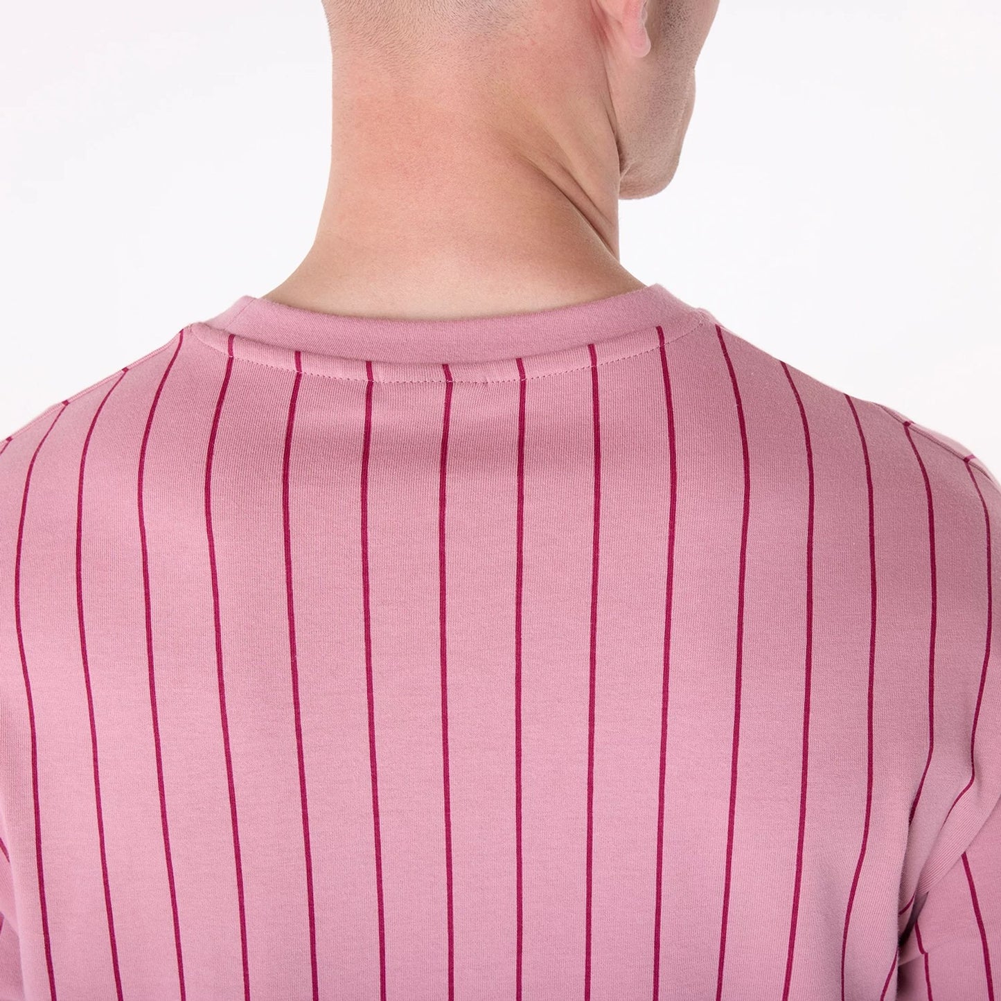 The Male model is wearing New Era Pinstripe Dark Pink Oversized T-Shirt 5