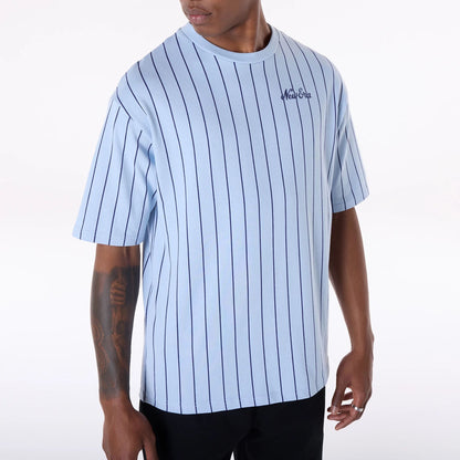 The Male model is wearing New Era Pinstripe Pastel Blue Oversized T-Shirt 7