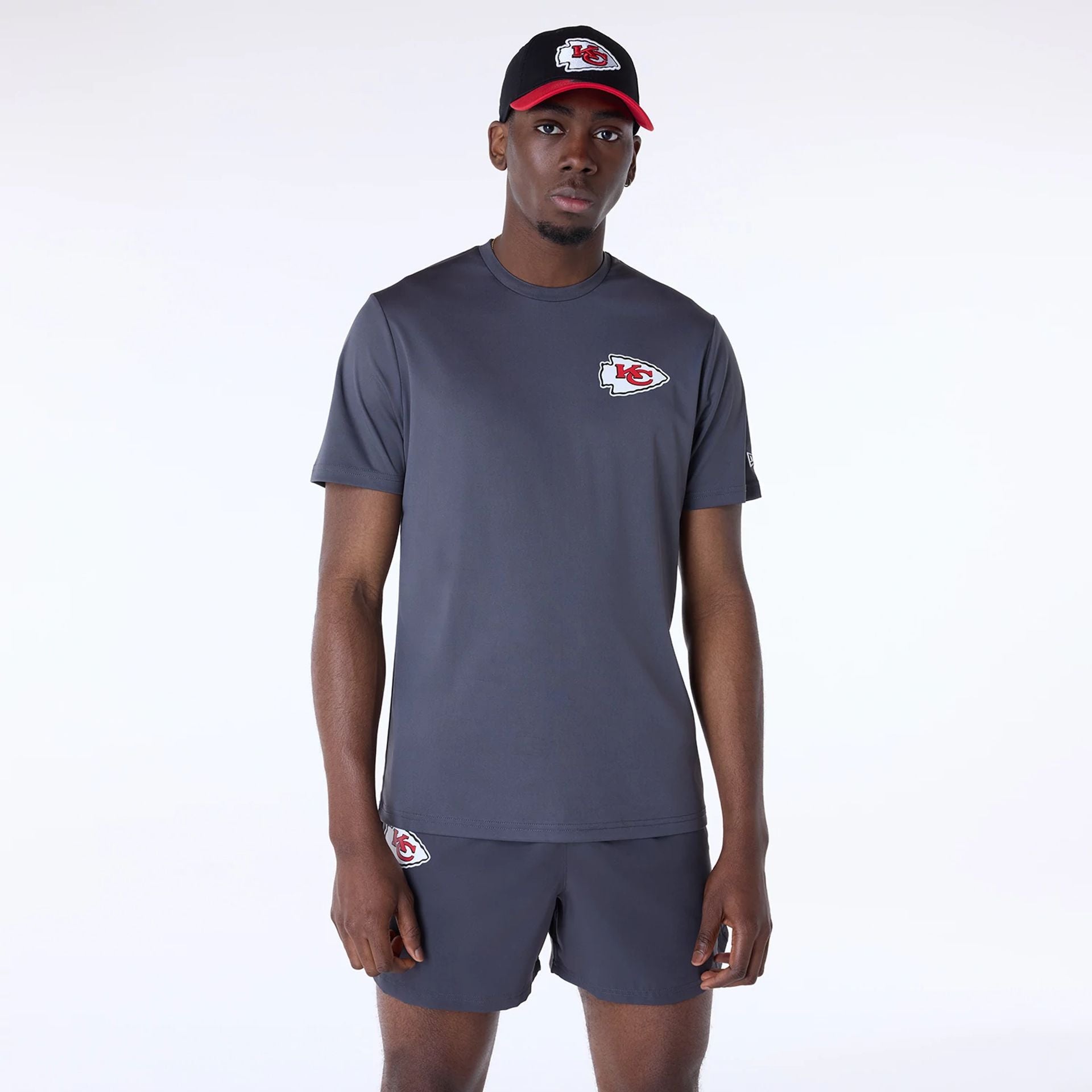 The Male model is wearing Kansas City Chiefs NFL Essentials Dark Grey T-Shirt 1