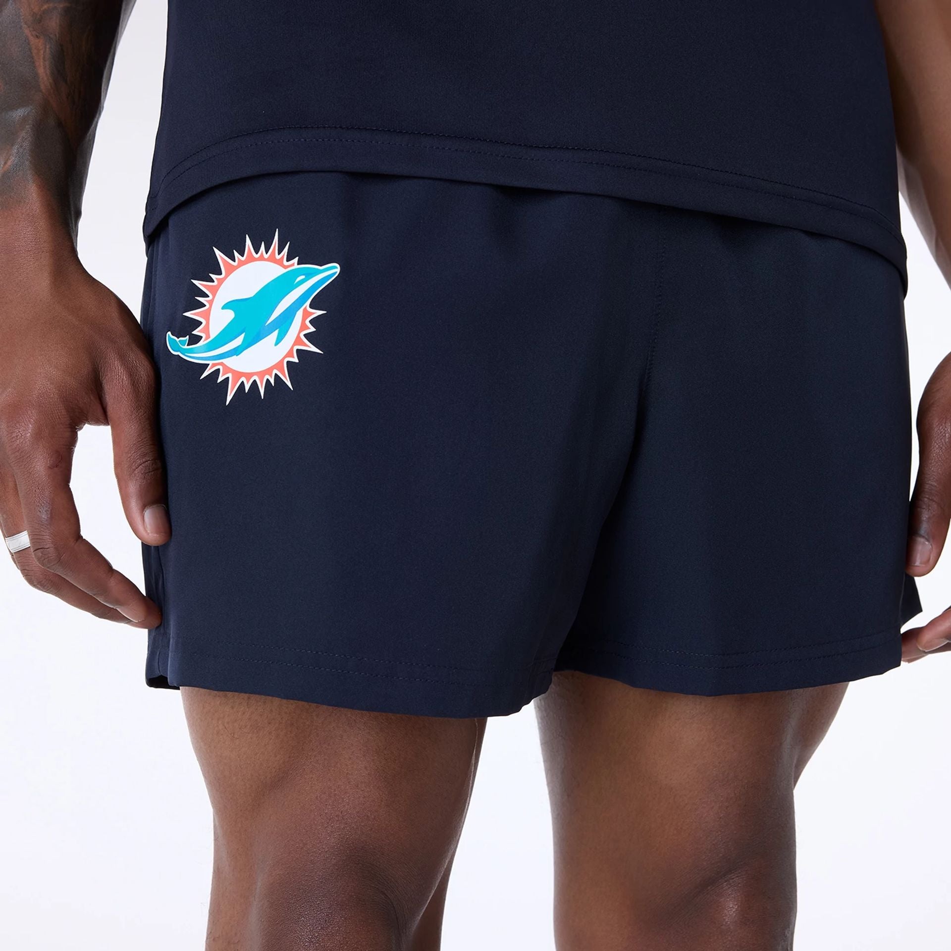 The Male model is wearing Miami Dolphins NFL Essentials Navy Shorts 8