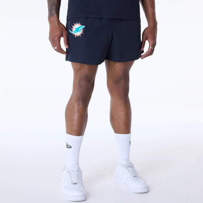 The Male model is wearing Miami Dolphins NFL Essentials Navy Shorts 1