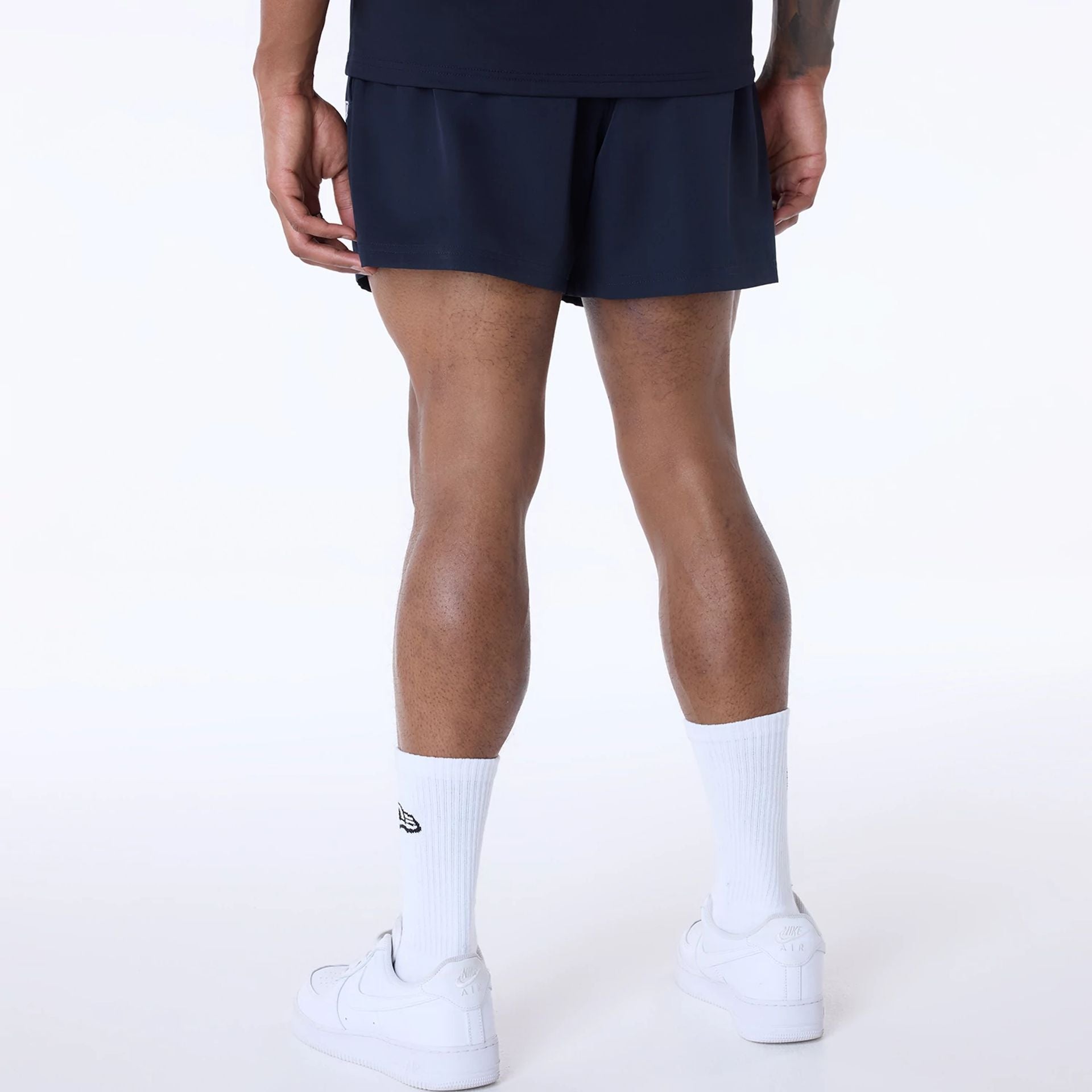 The Male model is wearing Miami Dolphins NFL Essentials Navy Shorts 2