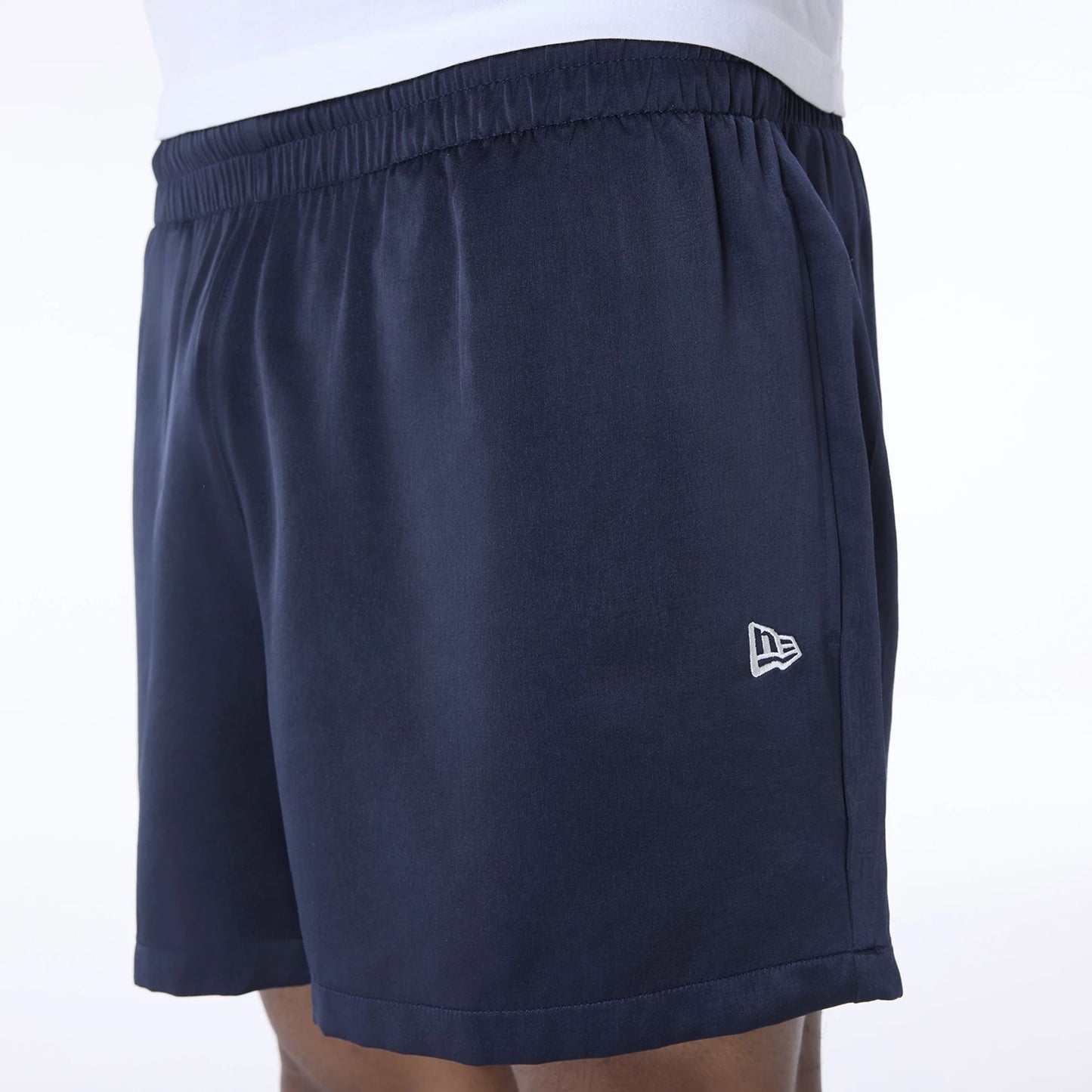 The Male model is wearing New Era Woven Navy Shorts 6