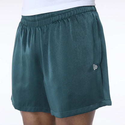 The Male model is wearing New Era Woven Dark Green Shorts 7