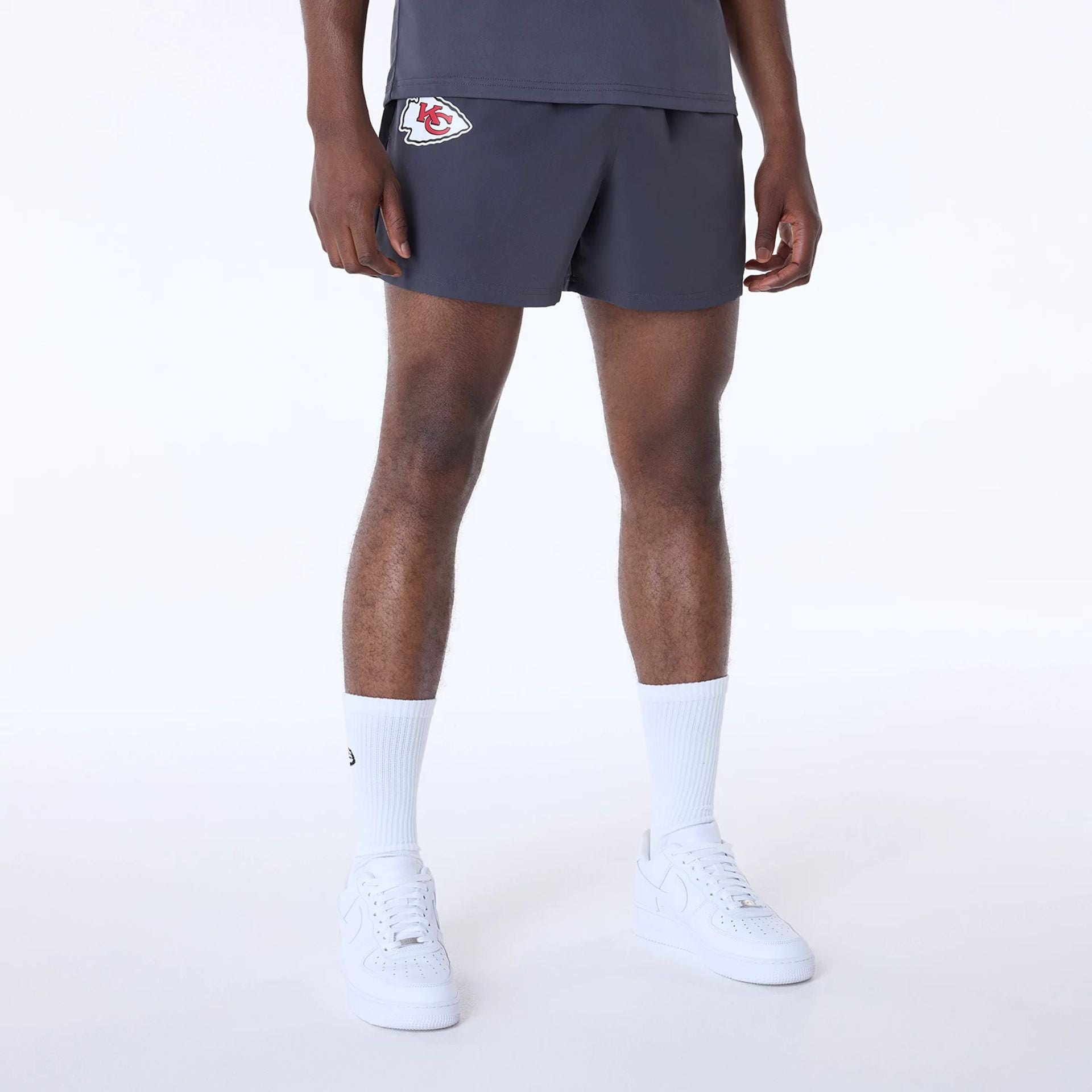 The Male model is wearing Kansas City Chiefs NFL Essentials Dark Grey Shorts 1