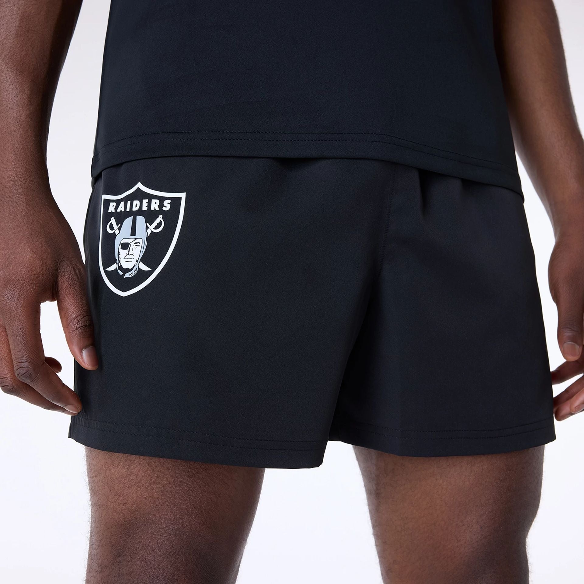 The Male model is wearing Las Vegas Raiders NFL Essentials Black Shorts 7