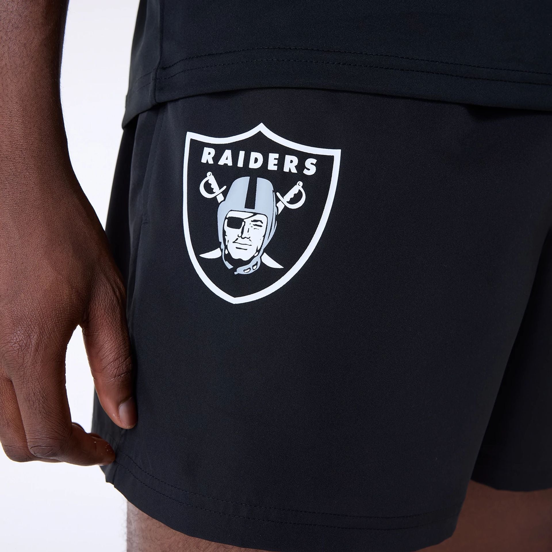 The Male model is wearing Las Vegas Raiders NFL Essentials Black Shorts 8