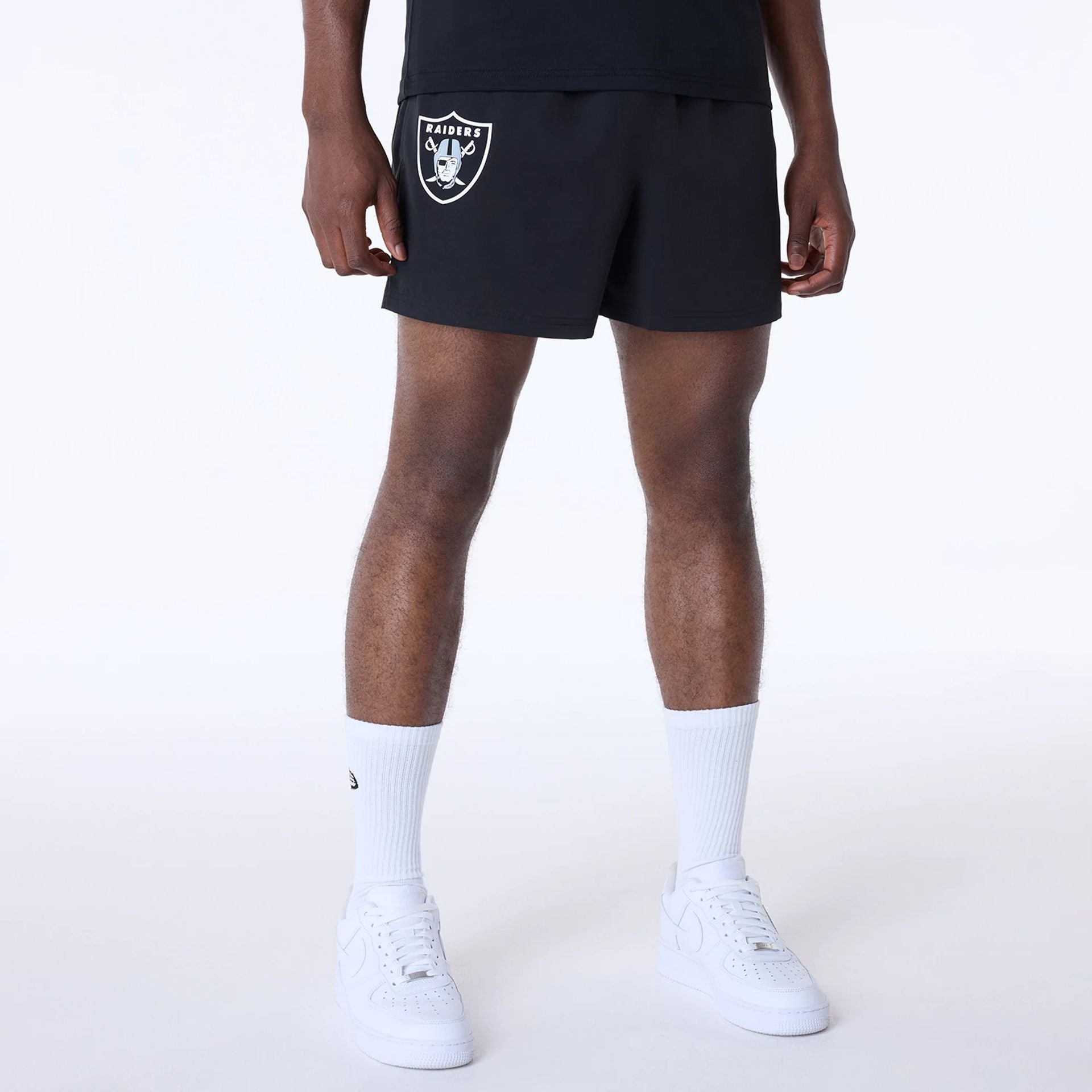 The Male model is wearing Las Vegas Raiders NFL Essentials Black Shorts 1