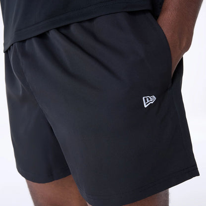 The Male model is wearing Las Vegas Raiders NFL Essentials Black Shorts 6