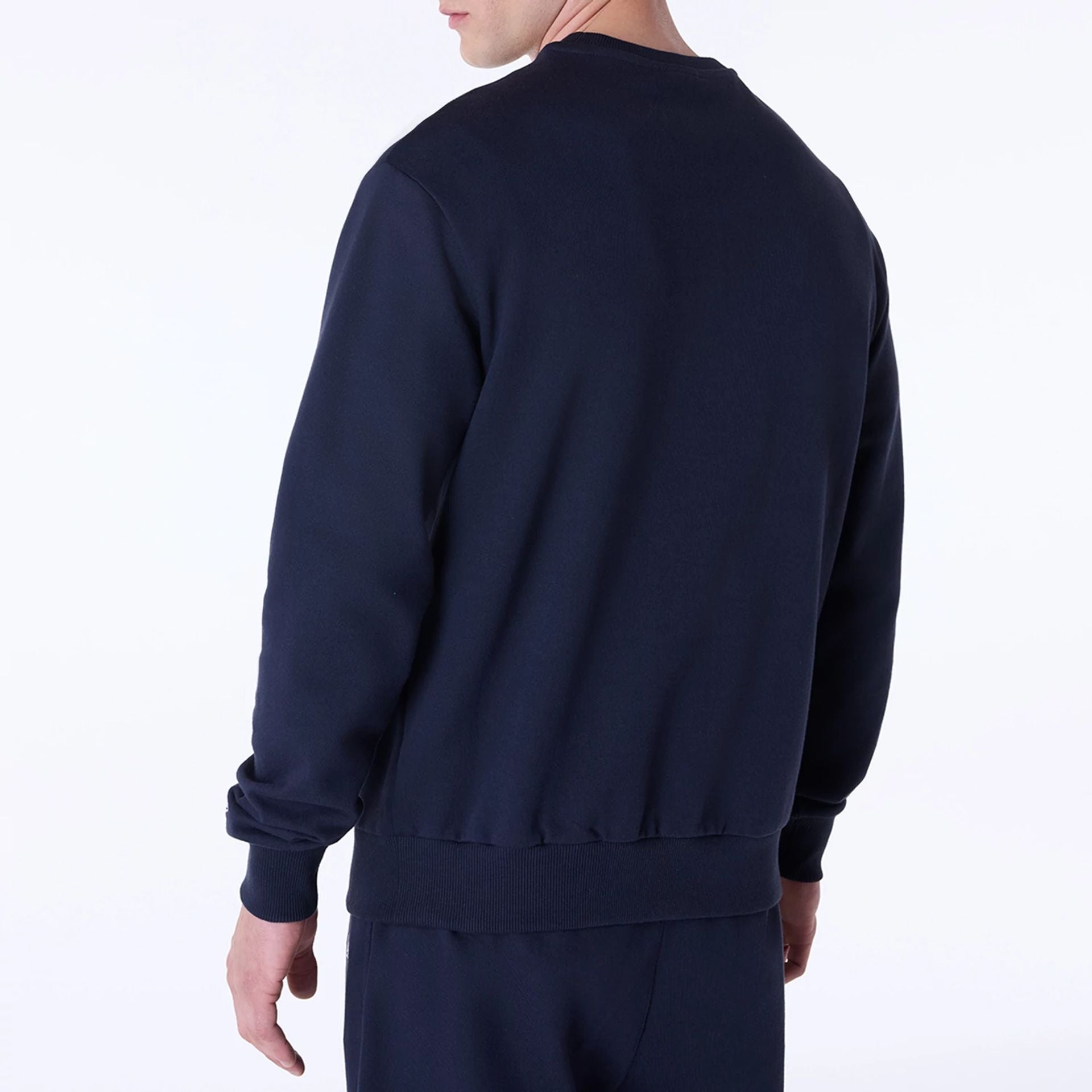 The Male model is wearing New Era Essential Navy Crew Neck Sweater 5