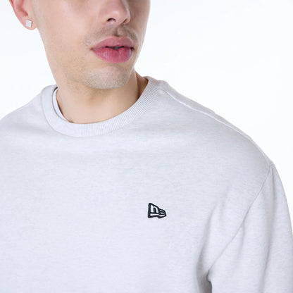 The Male model is wearing New Era Essential Pastel Grey Crew Neck Sweater 4