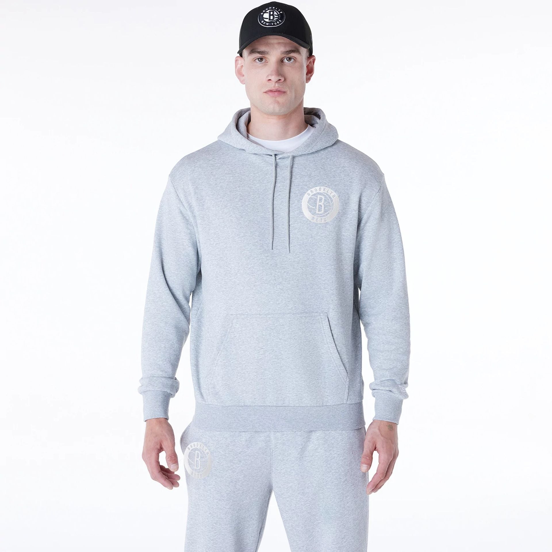 The Male model is wearing Brooklyn Nets NBA League Essential Grey Oversized Pullover Hoodie 1