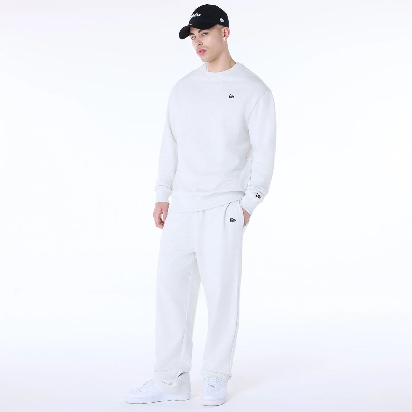 The Male model is wearing New Era Straight Pastel Grey Joggers 4