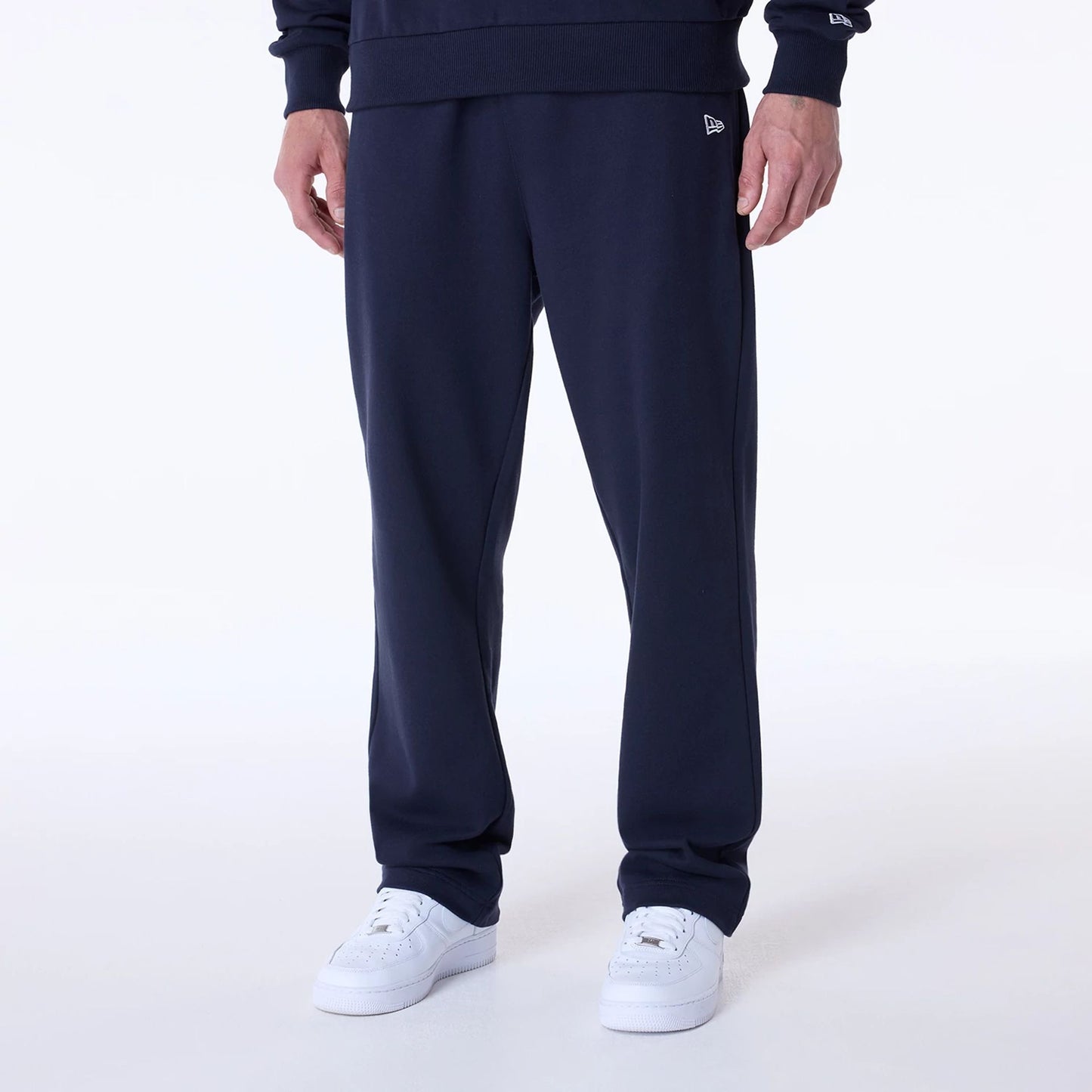 The Male model is wearing New Era Straight Navy Joggers 1