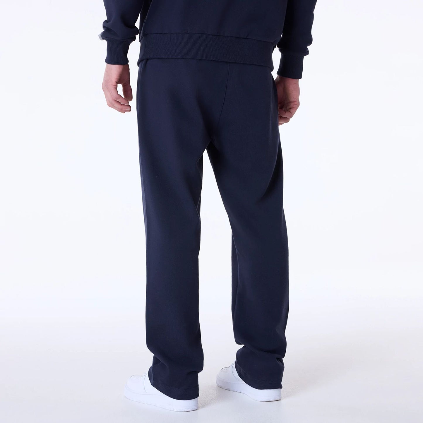 The Male model is wearing New Era Straight Navy Joggers 2