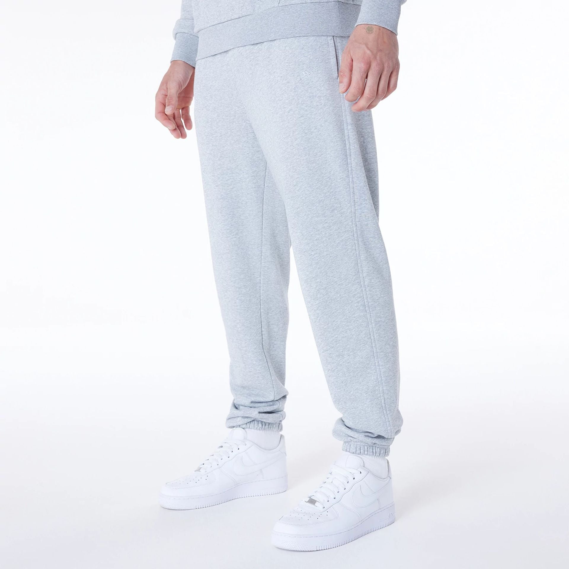 The Male model is wearing Brooklyn Nets NBA League Essential Grey Fleece Joggers 2