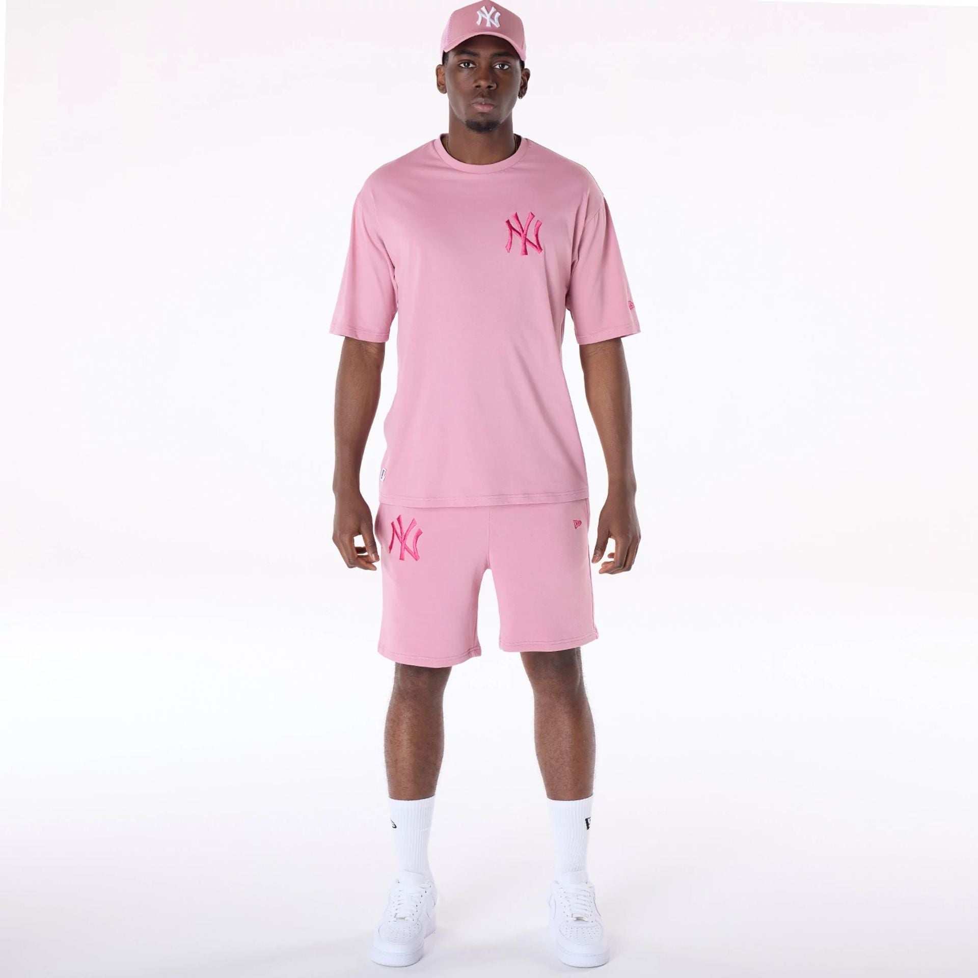 The Male model is wearing New York Yankees MLB League Essential Dark Pink Top And Shorts Set 1