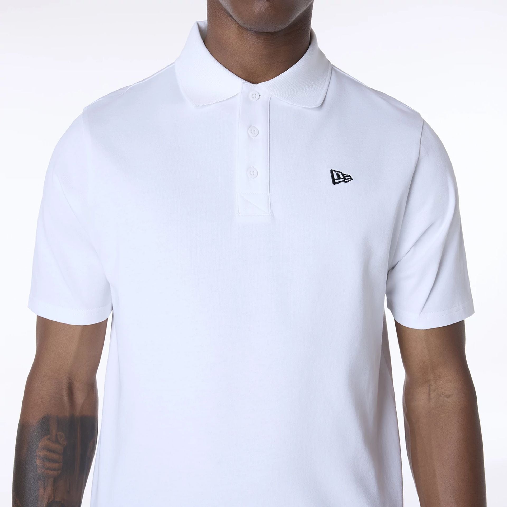 The Male model is wearing New Era Polo White T-Shirt 6