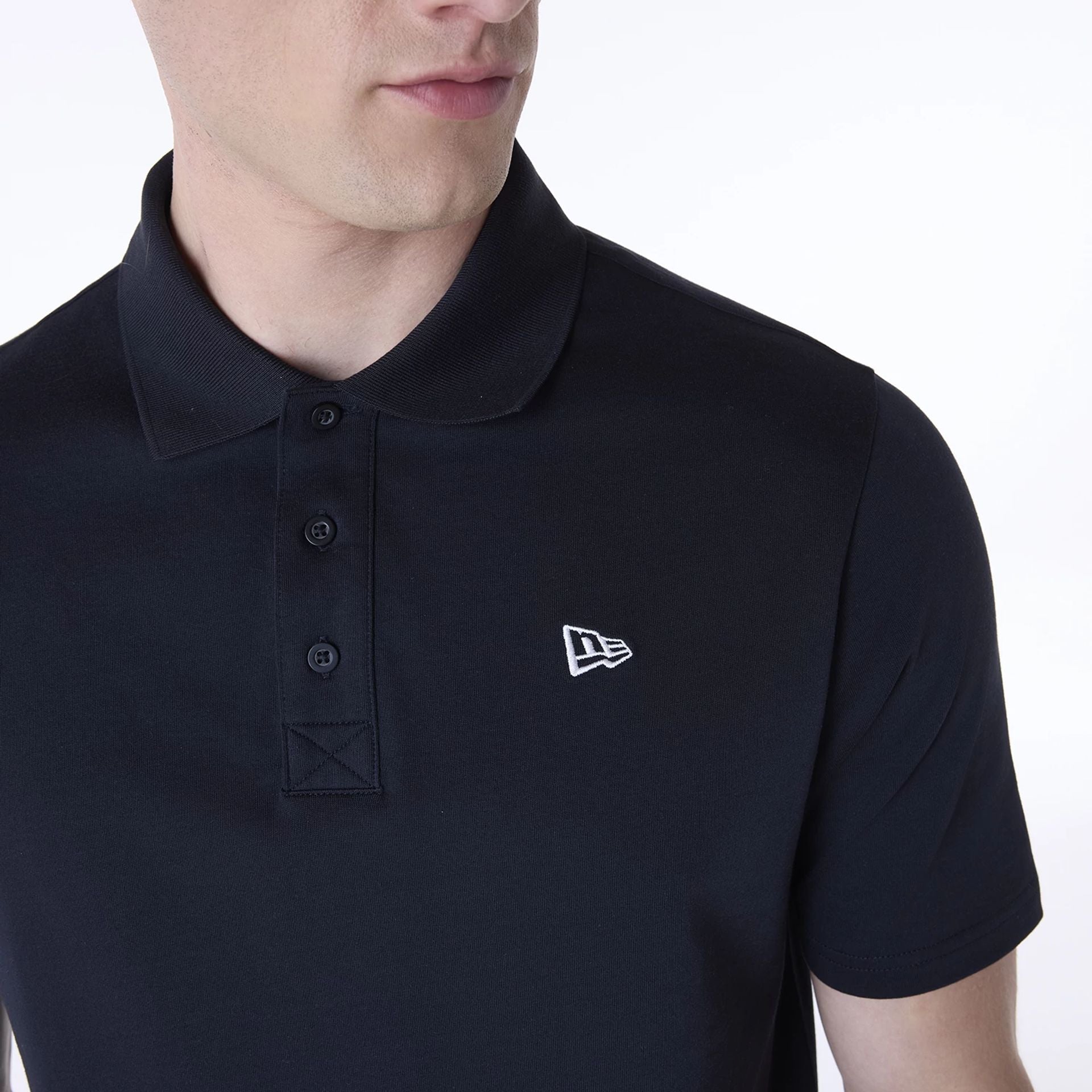 The Male model is wearing New Era Polo Navy T-Shirt 6