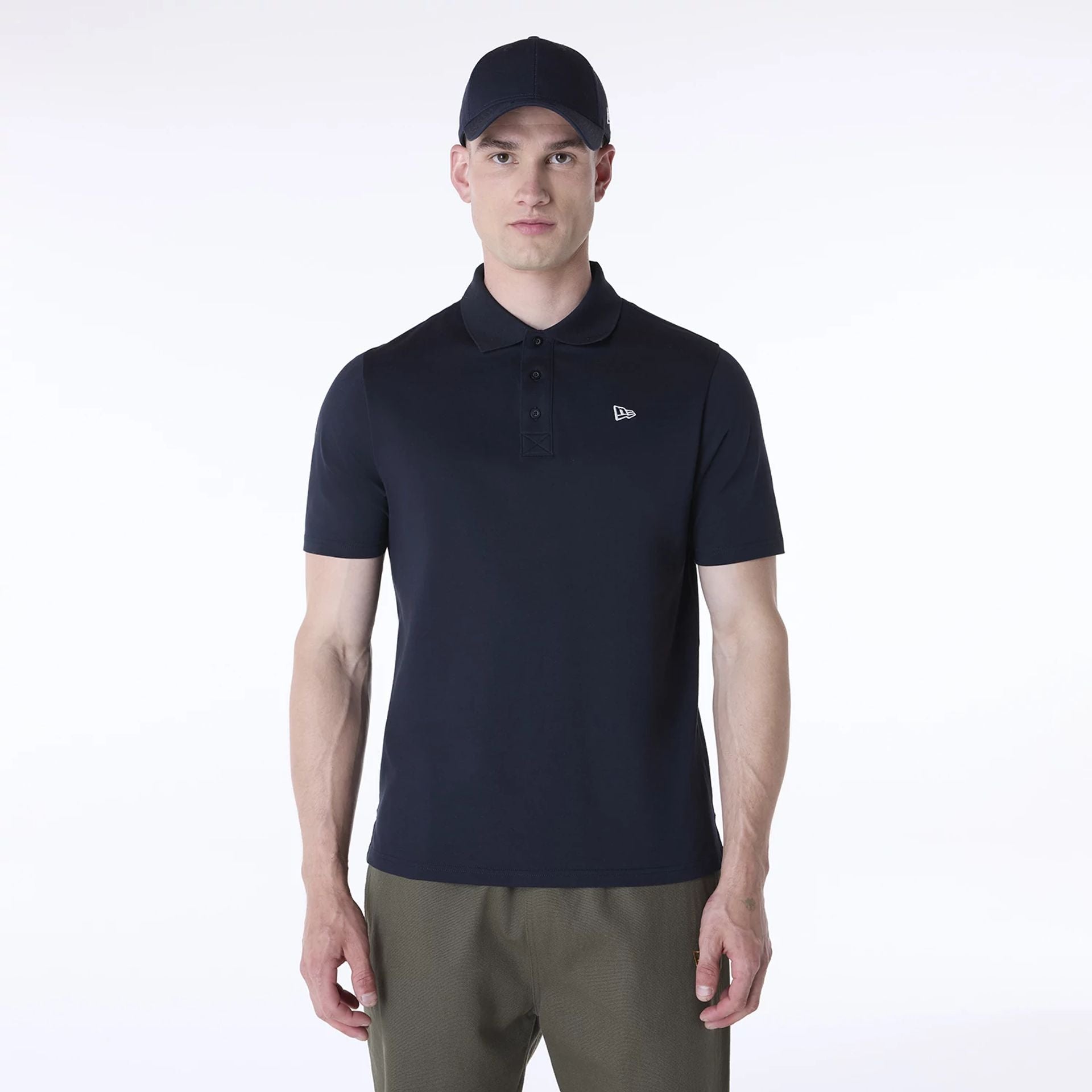 The Male model is wearing New Era Polo Navy T-Shirt 1