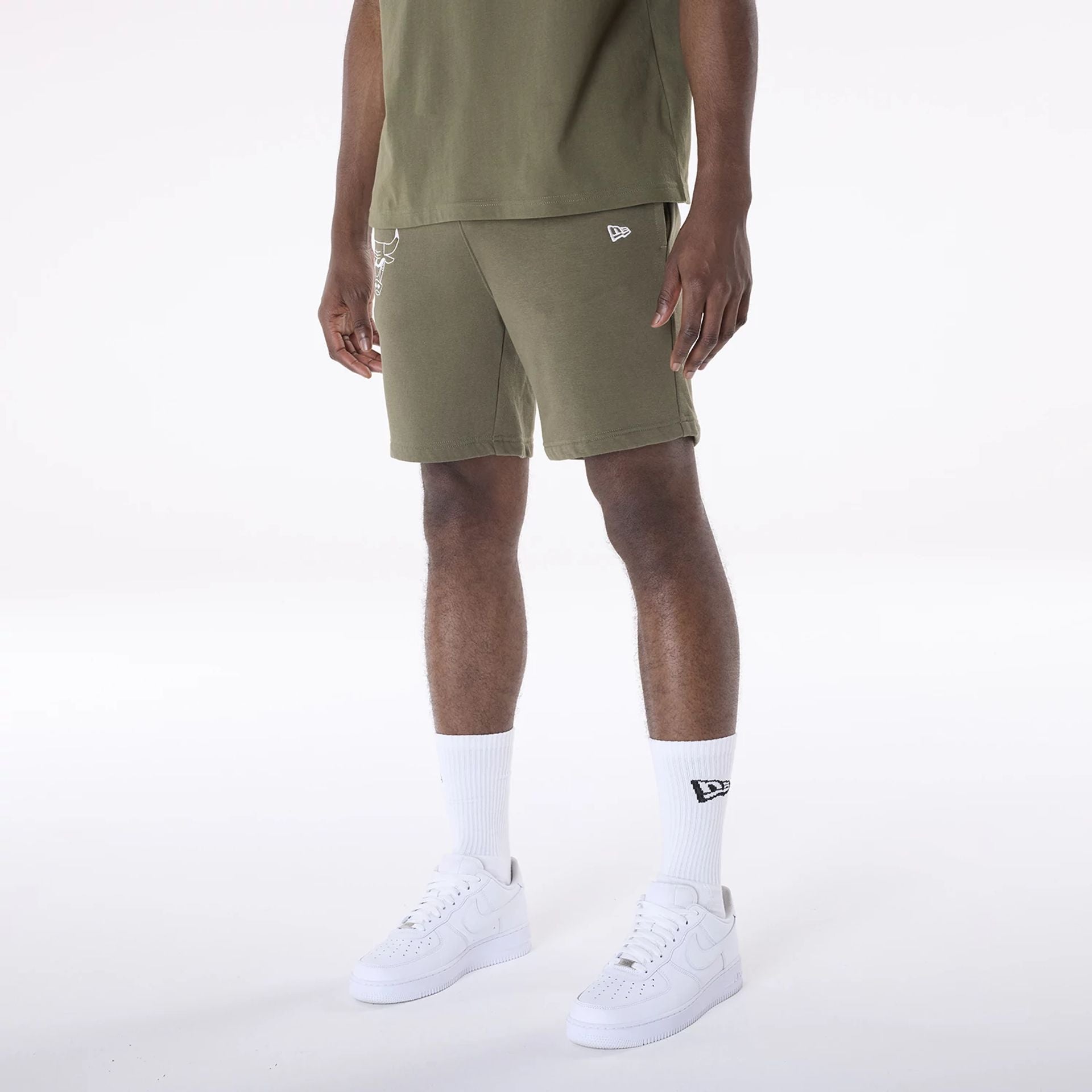 The Male model is wearing Chicago Bulls NBA League Essential Dark Green Shorts 2