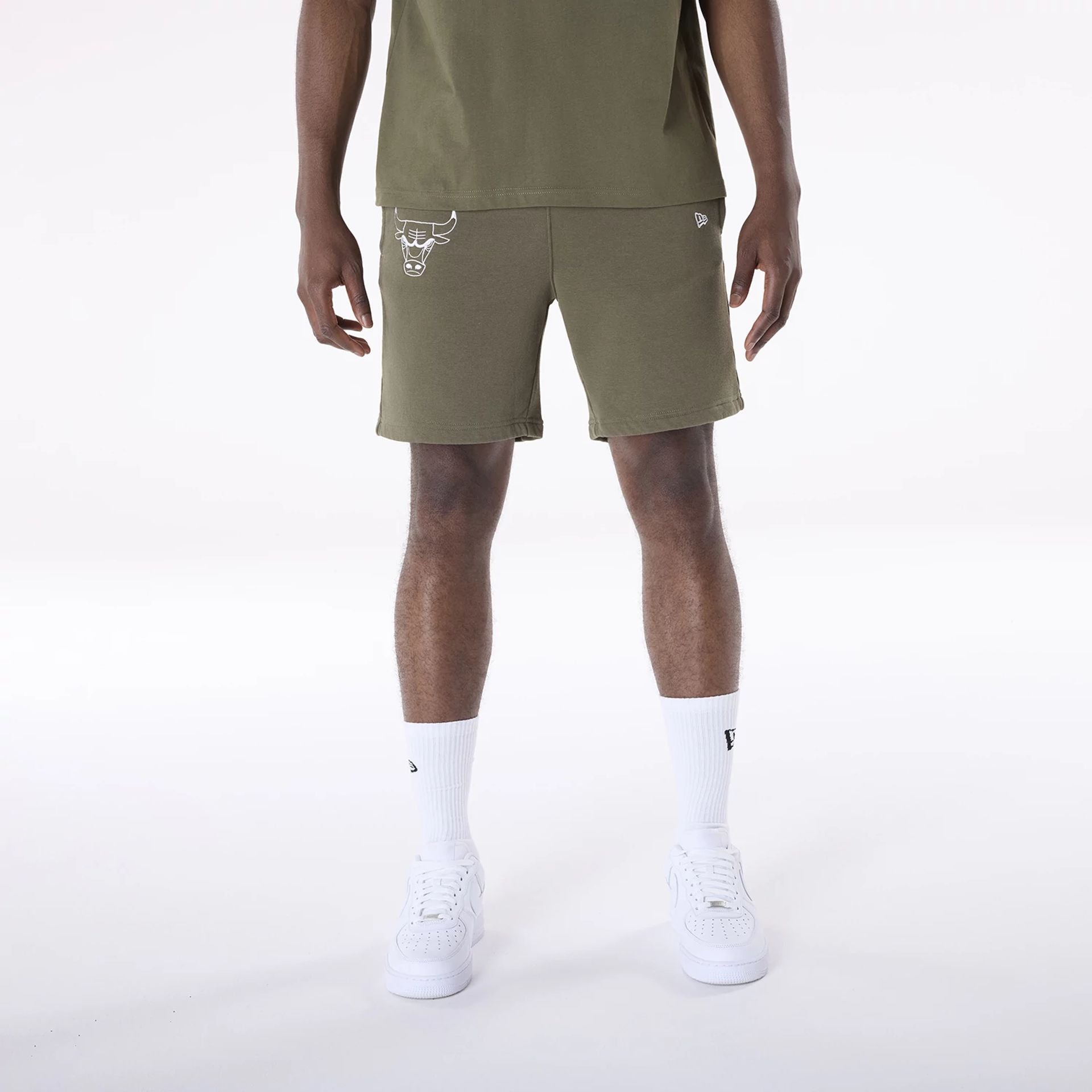 The Male model is wearing Chicago Bulls NBA League Essential Dark Green Shorts 1