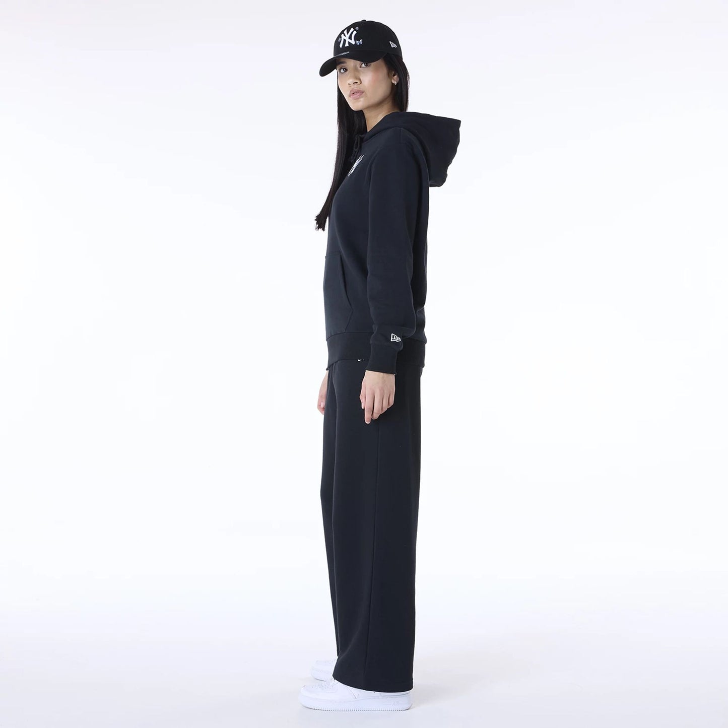 The Female model is wearing New York Yankees MLB League Essential Black Track Suit 3