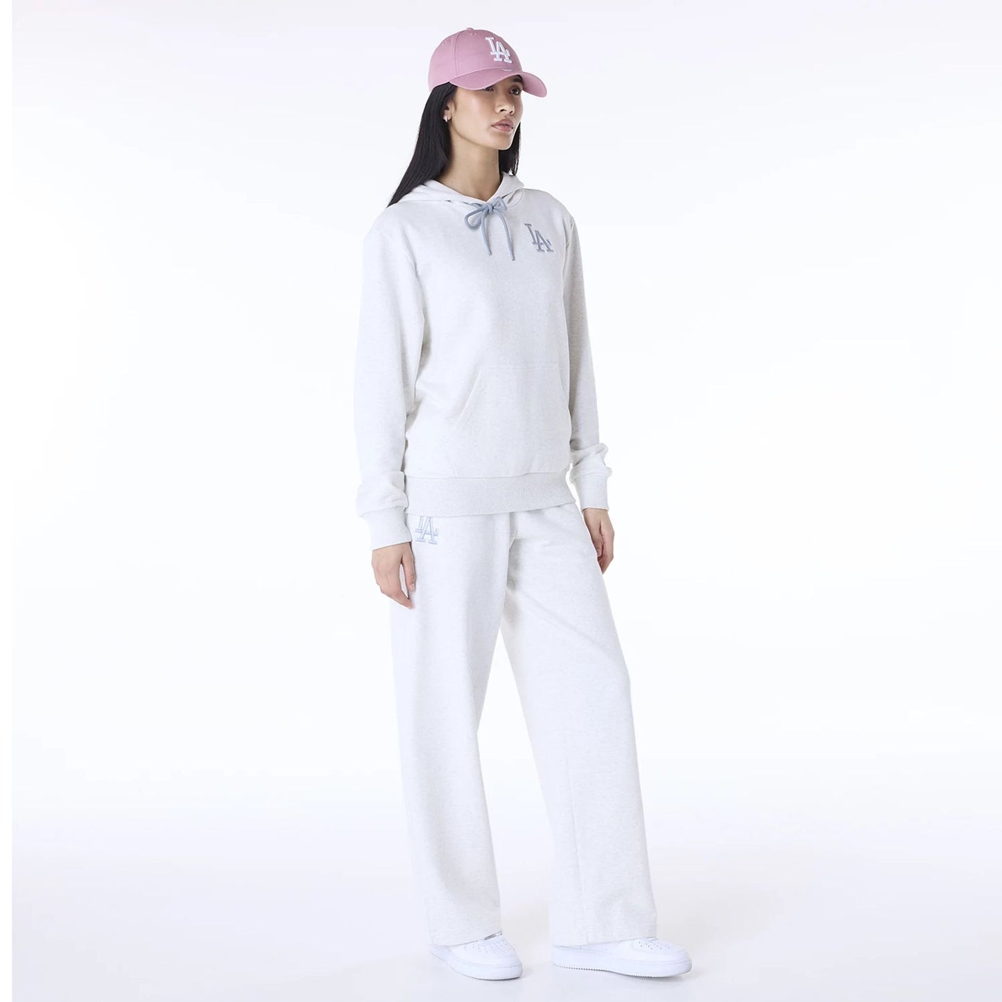 The Female model is wearing LA Dodgers MLB League Essential Pastel Grey Track Suit 2