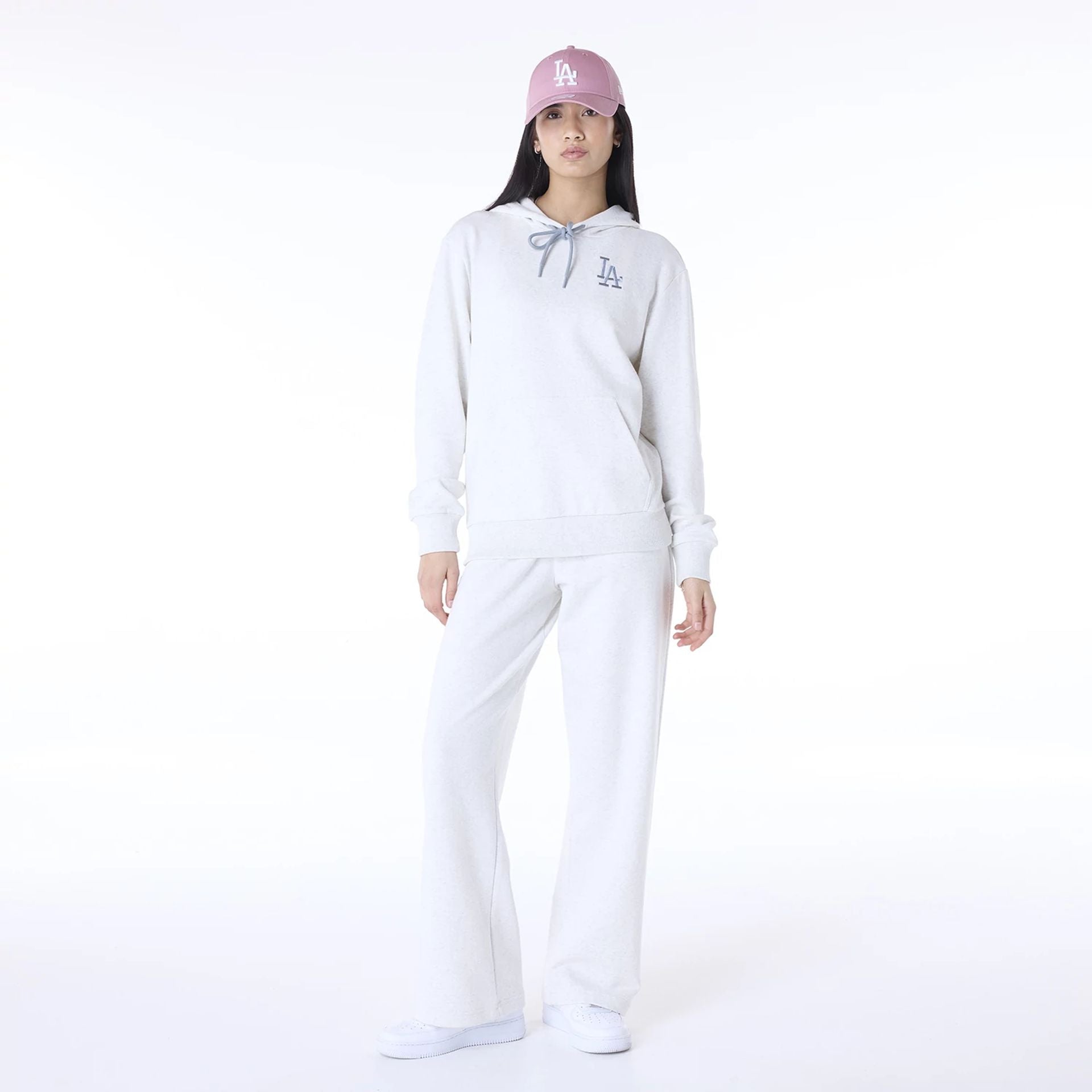 The Female model is wearing LA Dodgers MLB League Essential Pastel Grey Track Suit 1