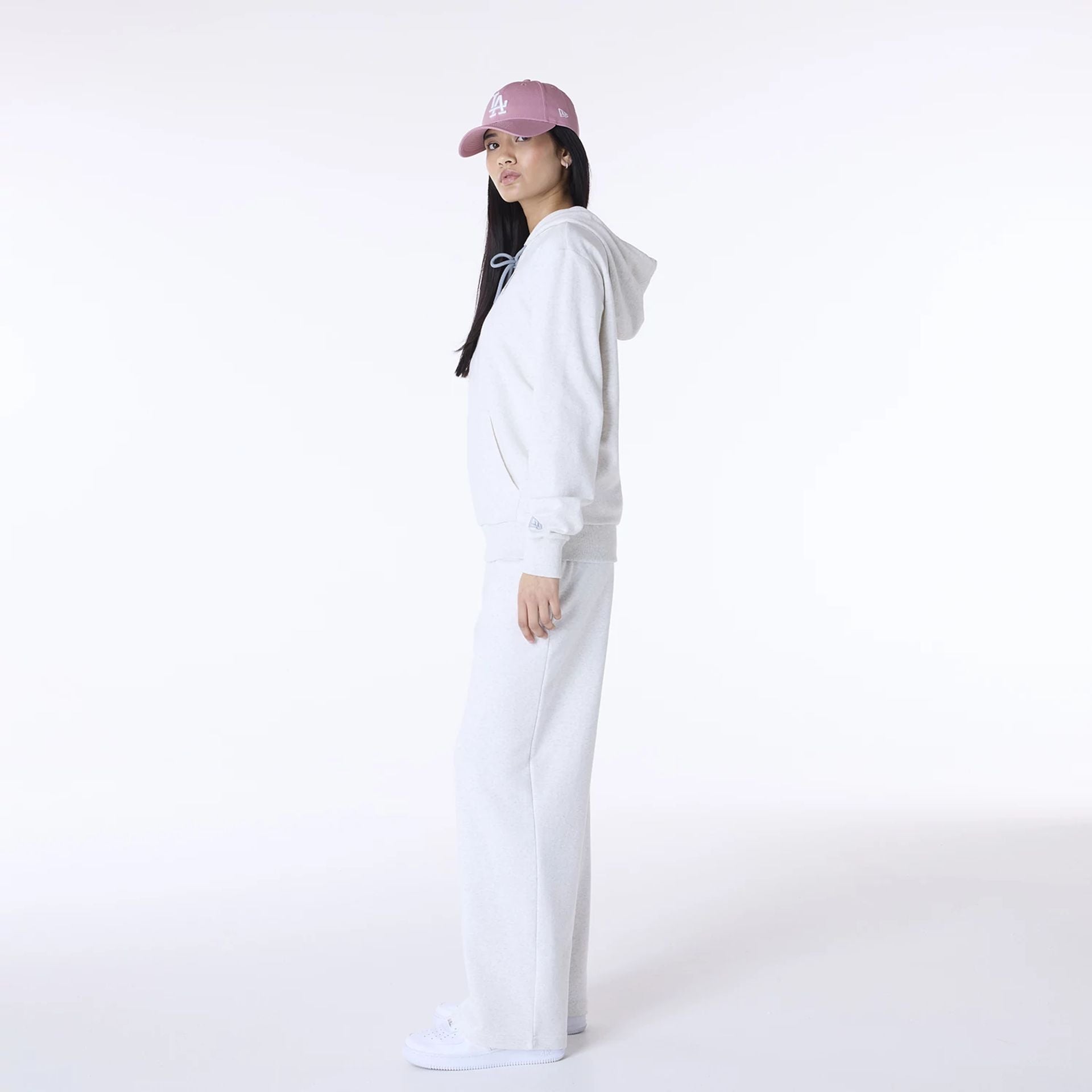 The Female model is wearing LA Dodgers MLB League Essential Pastel Grey Track Suit 5