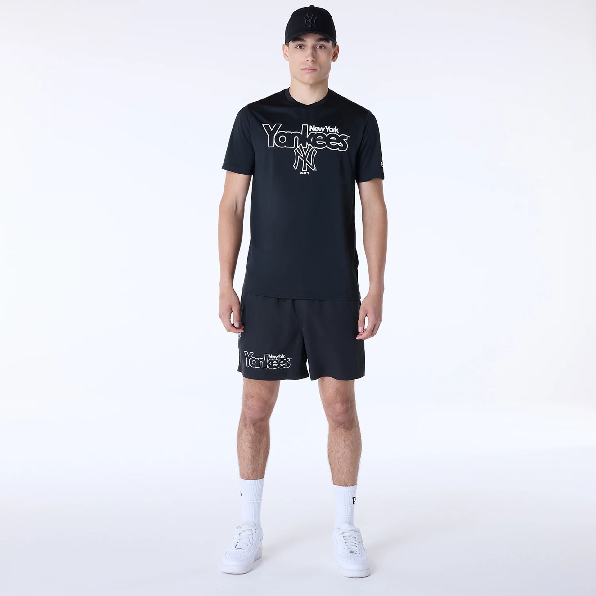 The Male model is wearing New York Yankees MLB Essential Black Top And Shorts Set 1