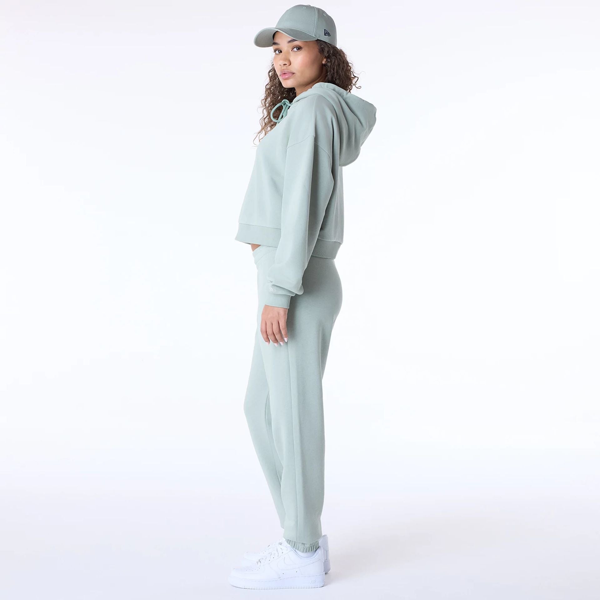 The Female model is wearing New Era Script Pastel Green Track Suit 1