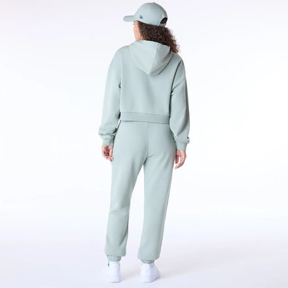 The Female model is wearing New Era Script Pastel Green Track Suit 4