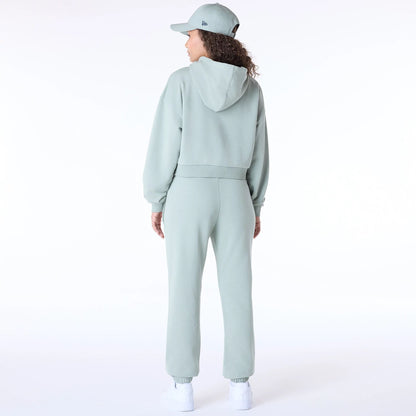 The Female model is wearing New Era Script Pastel Green Track Suit 3