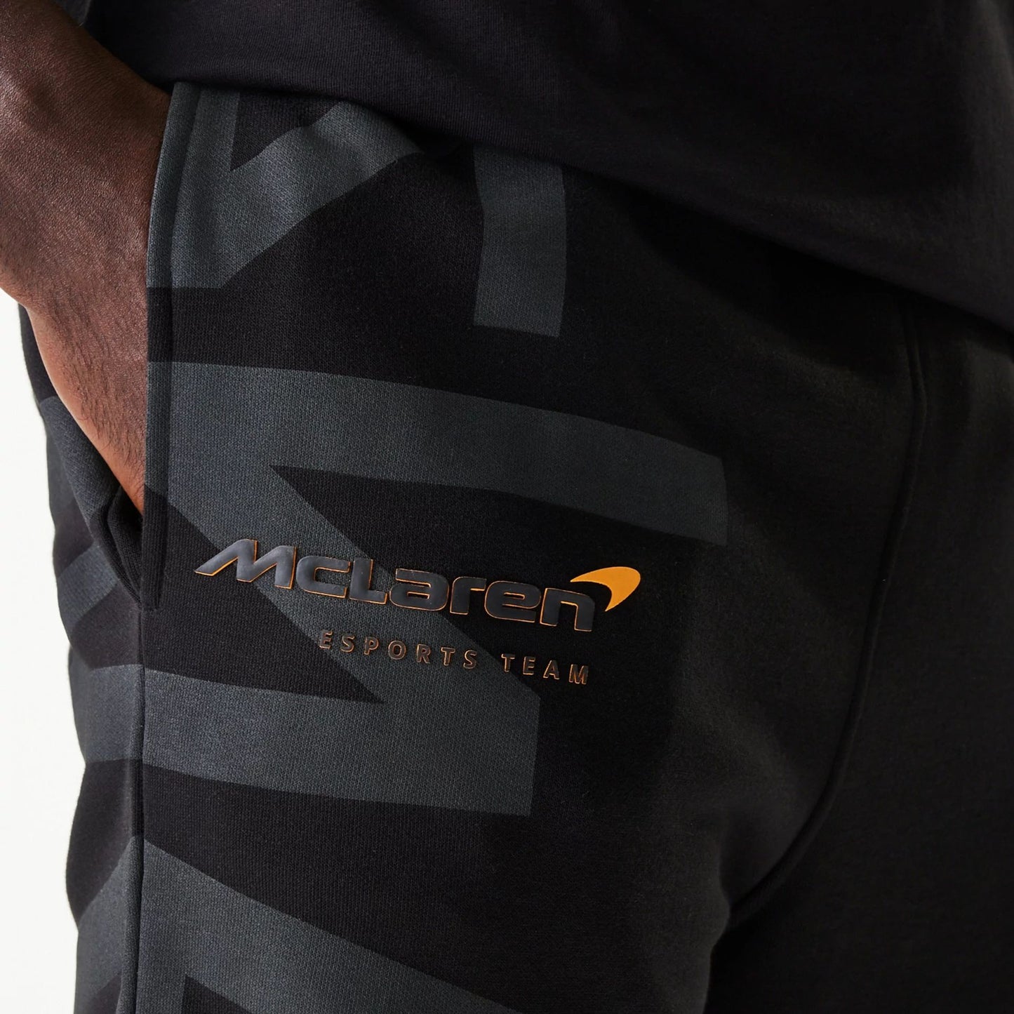 The Male model is wearing McLaren Racing Shadow Black Fleece Joggers 4