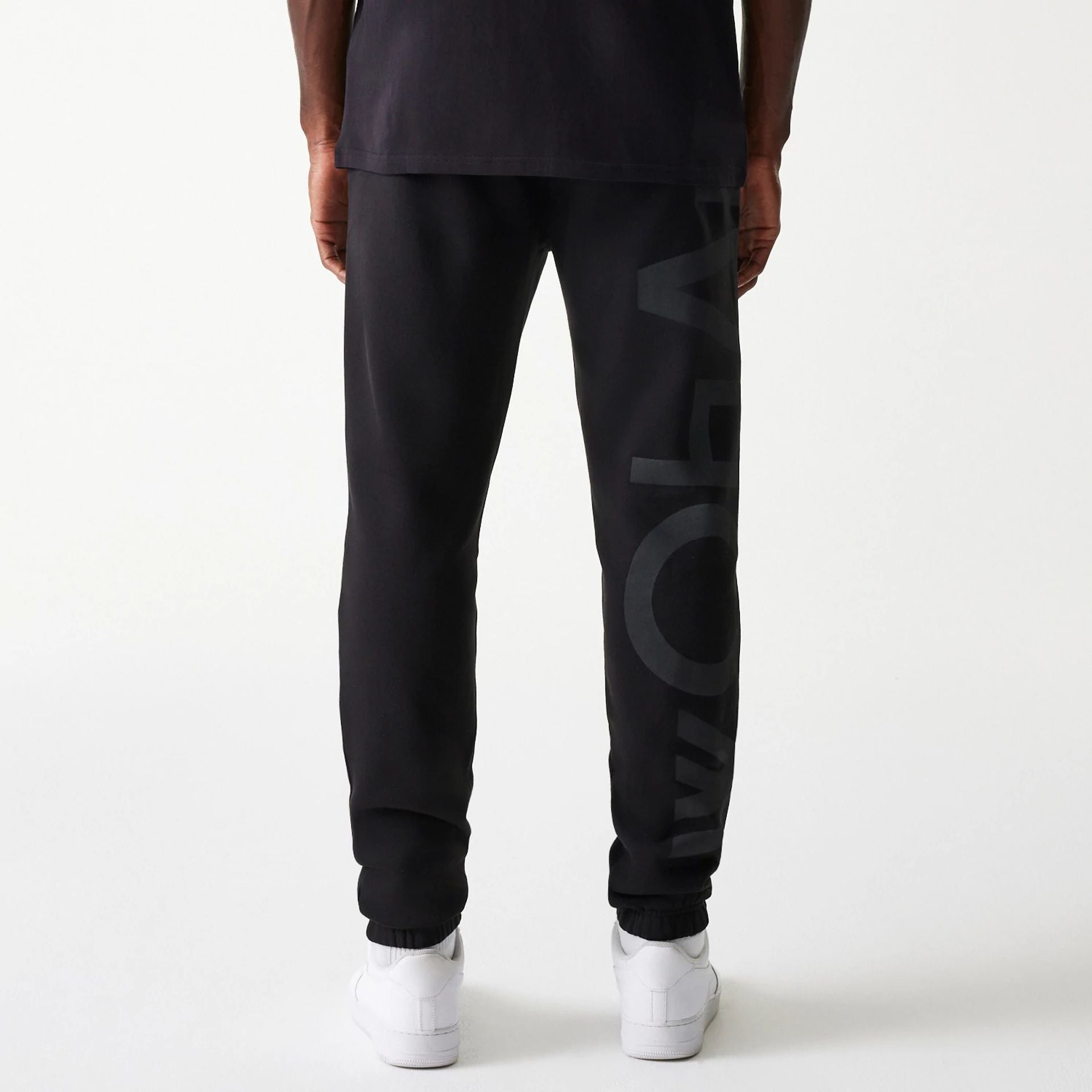 The Male model is wearing McLaren Racing Shadow Black Fleece Joggers 2