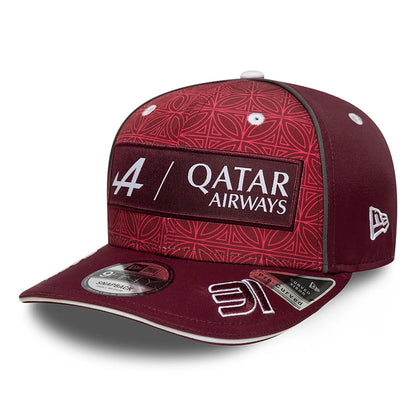 This is a Alpine Racing x Qatar Esteban Ocon Dark Red 9FIFTY Snapback Cap 1